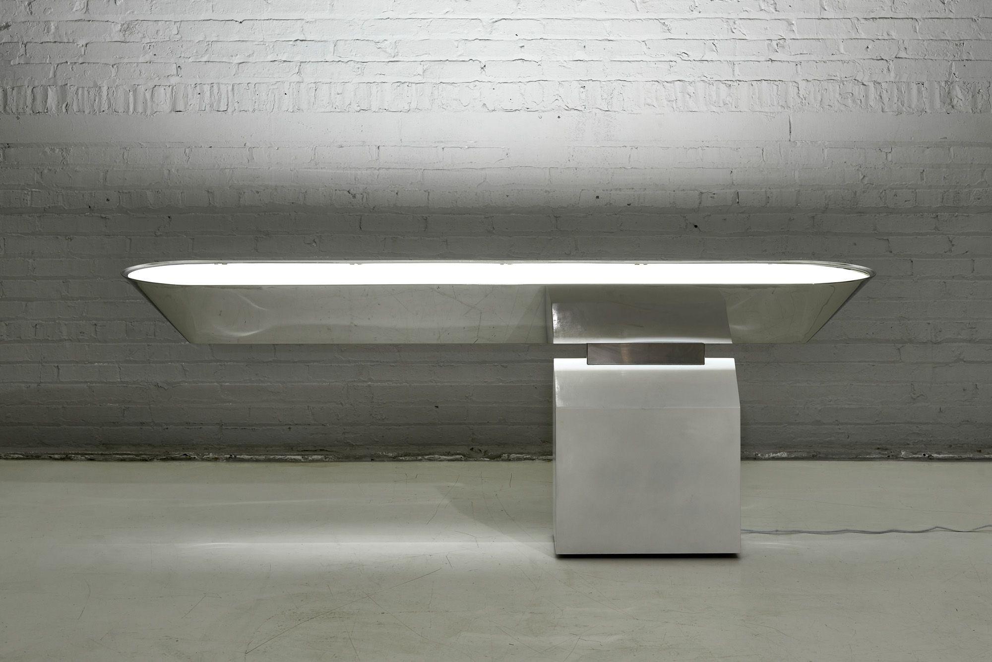 J. Wade Off Beam stainless console for Brueton, 1970. Cantilevered design illuminated.