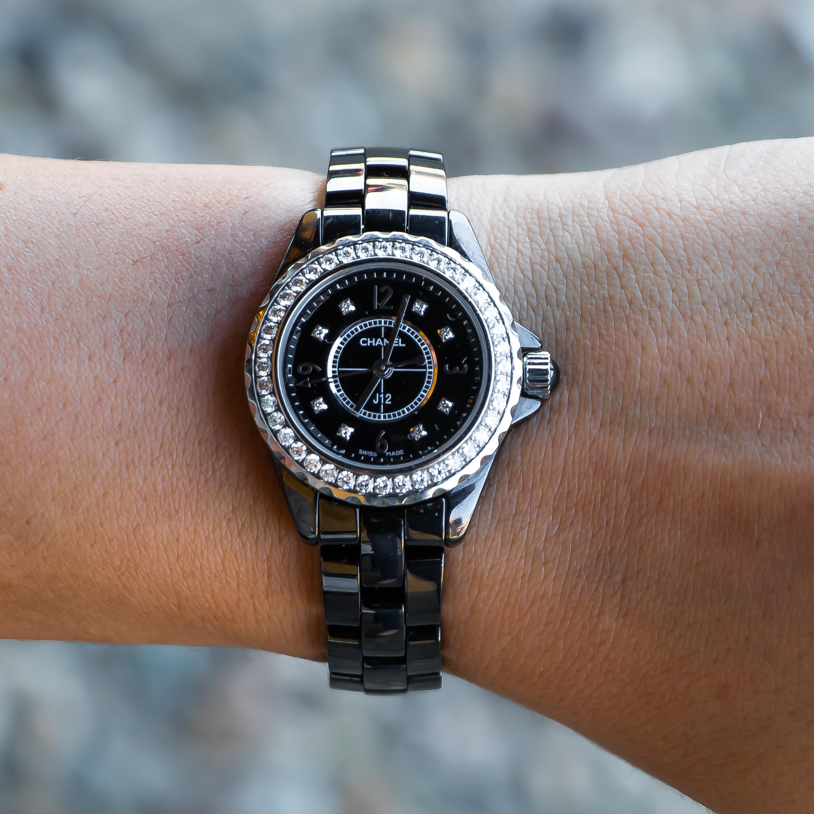 Brand: Chanel
High Precision Quartz Movement
Black Ceramic & Steel Fixed Bezel Set 
Case Dimensions: 29 mm
Water Resistance 50 Meters
40 Brilliant Cut Diamonds = 0.90 Carats
Black Lacquered Sial Set With 8 Diamond Indicators = 0.04 carat
Wrist Size: