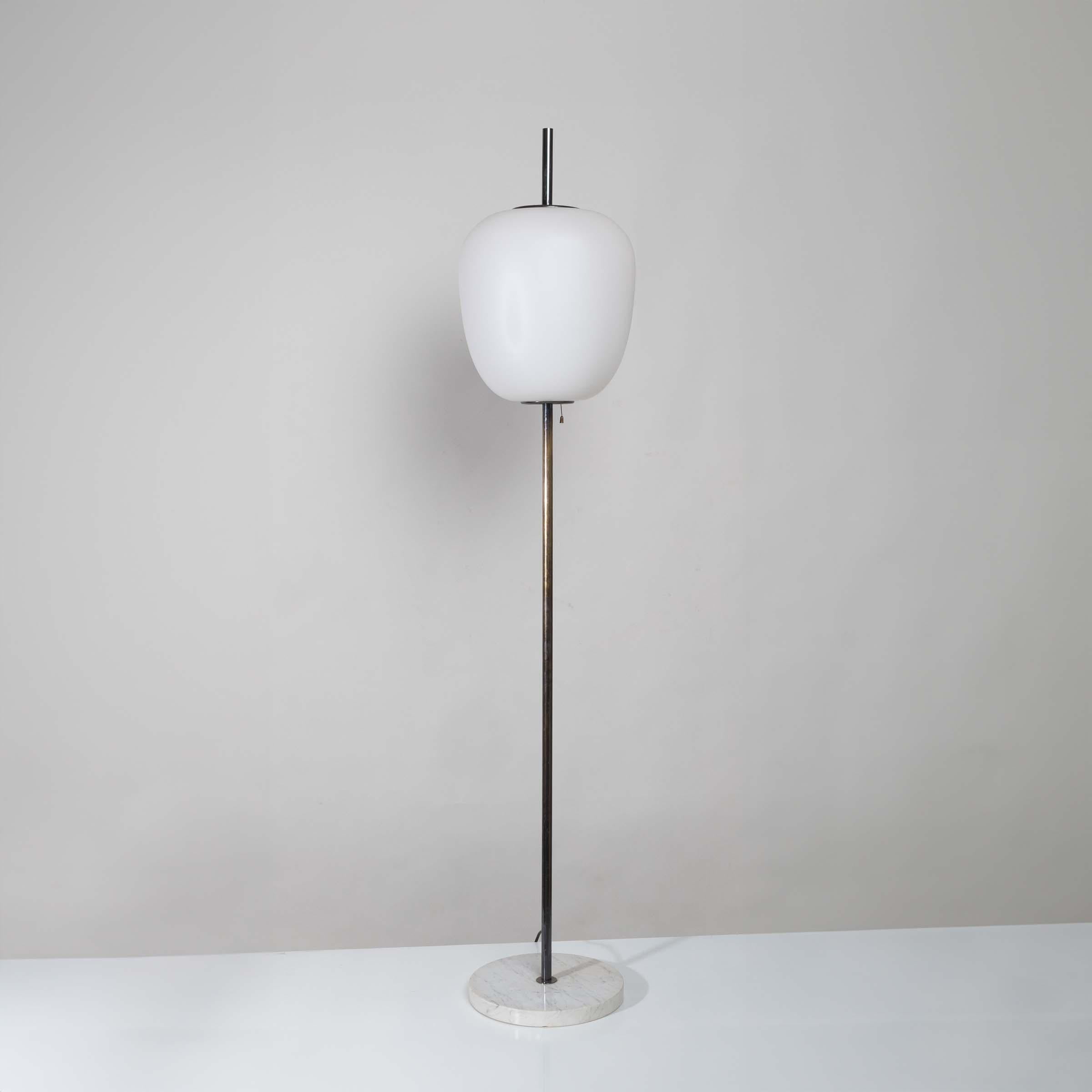 The J14 floor lamp, designed by Joseph-André Motte, epitomizes timeless elegance and artistic refinement. Its marble base provides a solid and luxurious foundation, while the brass stem boasts a “gunmetal” finish, adding a contemporary and