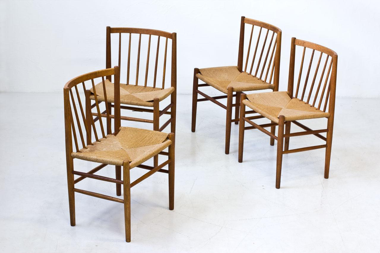 Set of four dining chairs model J80 by Jørgen Baekmark for FDB Møbler in Denmark, produced during the 1950s. Chairs made from solid oak frame and paper cord seats.