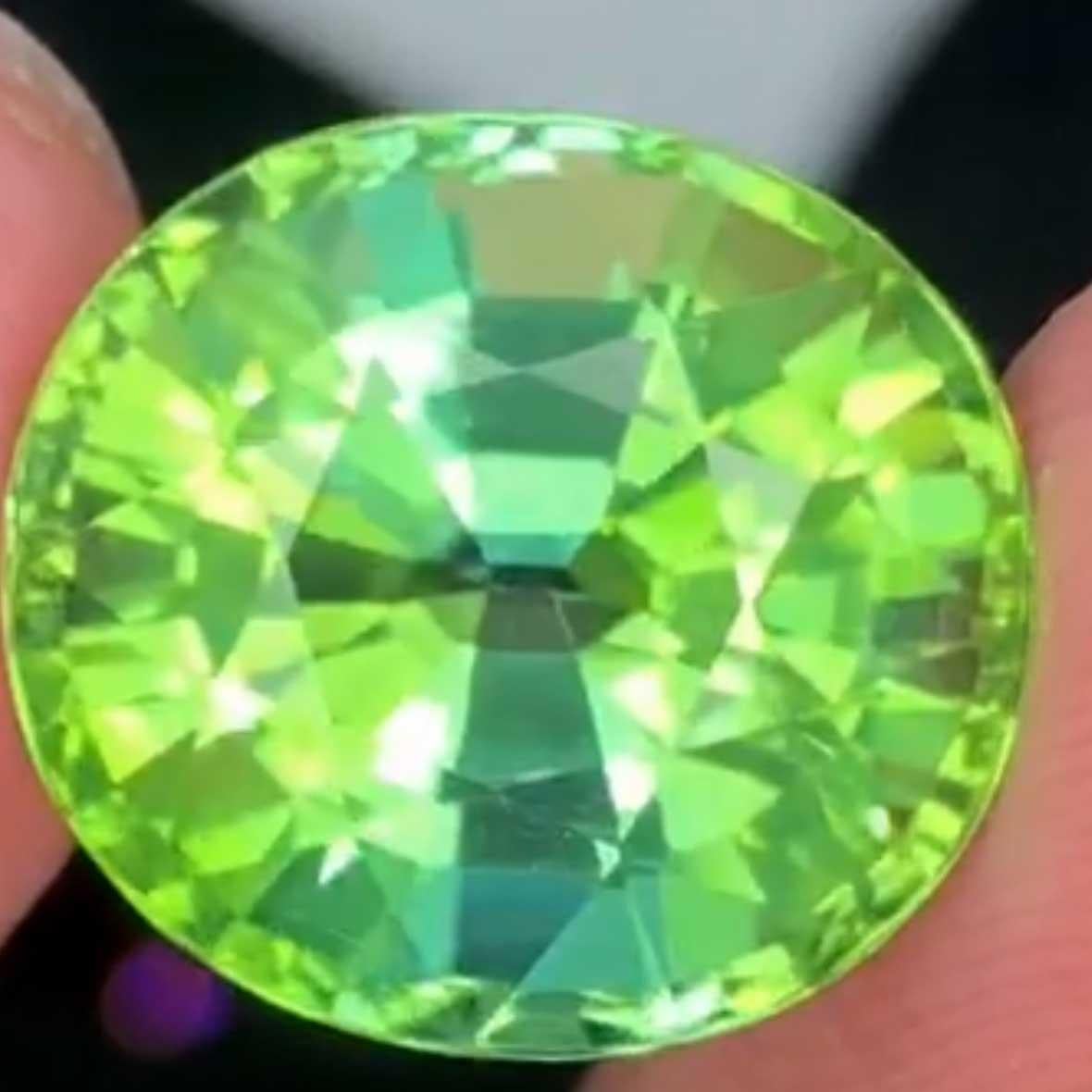 
 the most beautiful among the beautiful, a neon green-blue-yellow tourmaline from Afghanistan in the color green (verdelite) with a C-axis in yellow color, always special due to the particularly high light refraction and brilliance of the Afghan