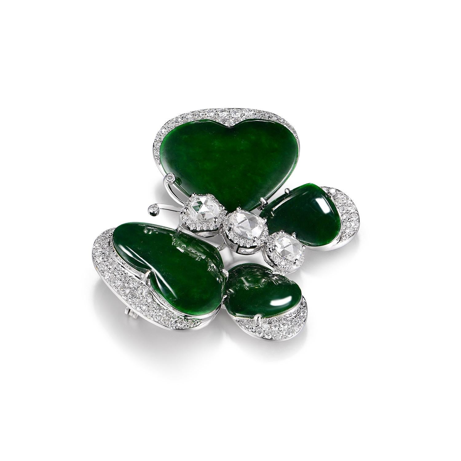 Embrace the elegance of nature with this exquisite butterfly brooch, impeccably crafted in pristine 18K white gold. The wings, delicately shaped from luxurious jadeite weighing 5.30ct, showcase a mesmerizing deep green hue, reminiscent of enchanted