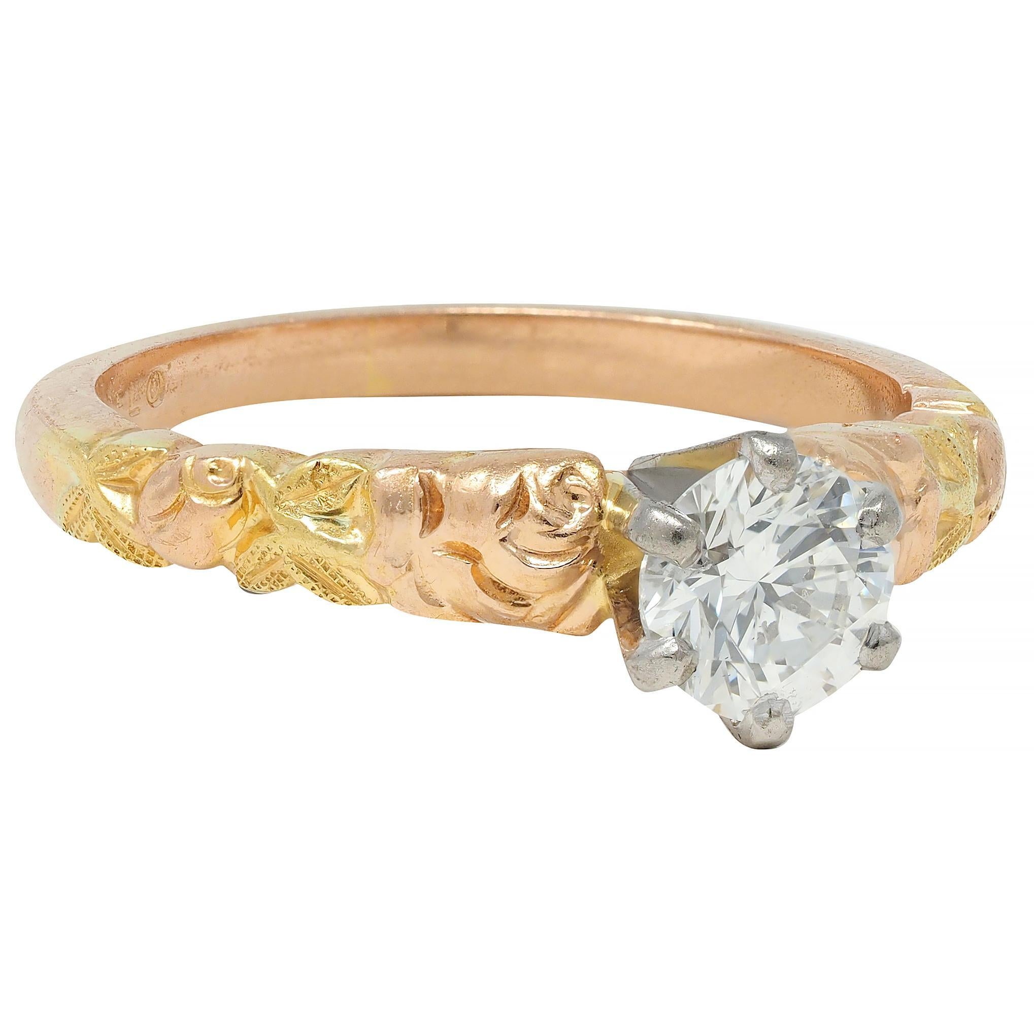 Centering a round brilliant cut diamond weighing approximately 0.45 carat
G color with VS2 clarity set in a six-pronged white gold mount
Flanked by grooved rose and foliate motif shoulders
Roses and shank are rose gold, and foliate is yellow
Stamped