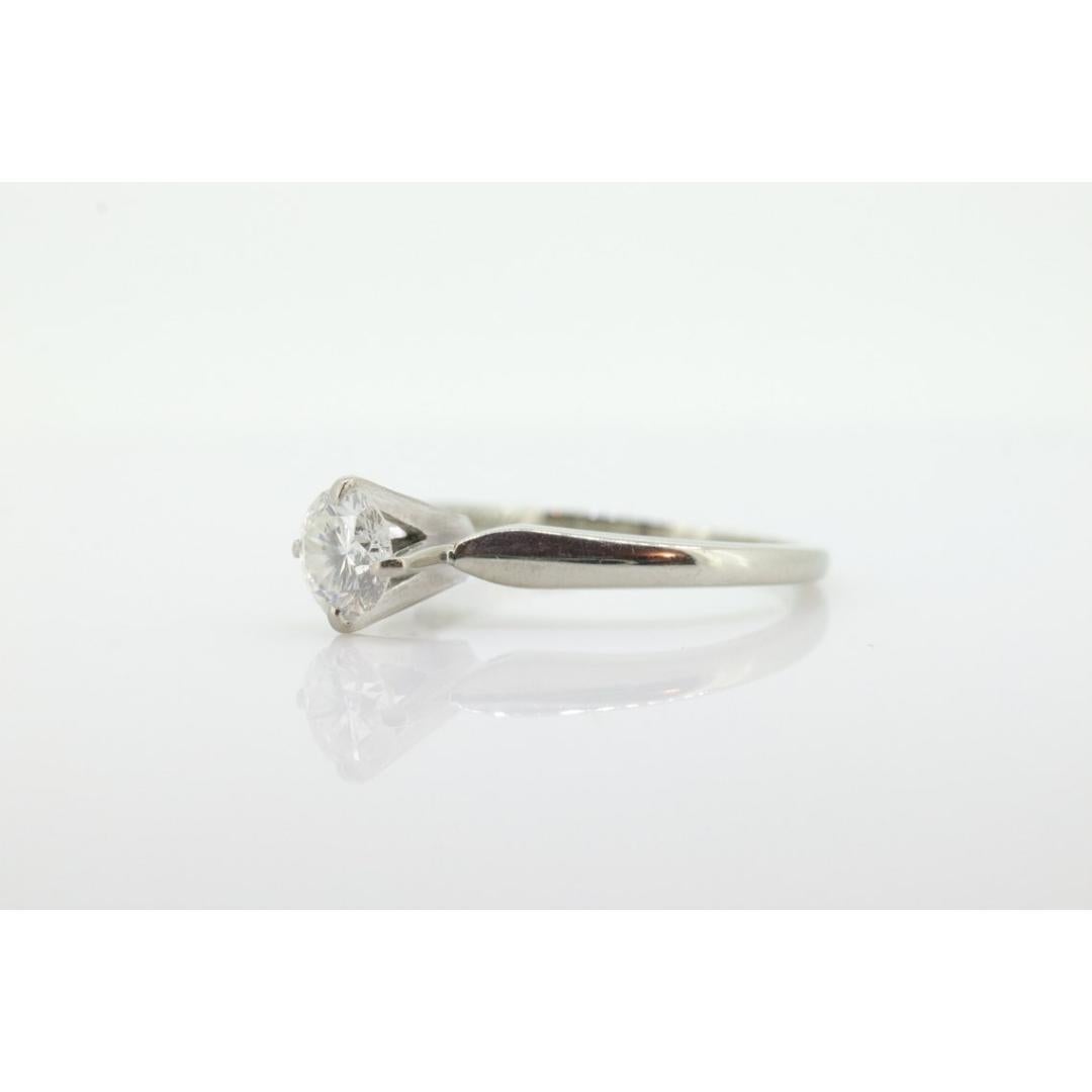 Vintage from the 1950s
Materials: Gold
Band color: White
Adjustable
Style: Art deco
Beautiful Vintage 18k Solitaire 1/2ct Diamond Engagement Ring. These are getting harder to come by.

Made By JABEL

High Quality made.


Condition: has tiny