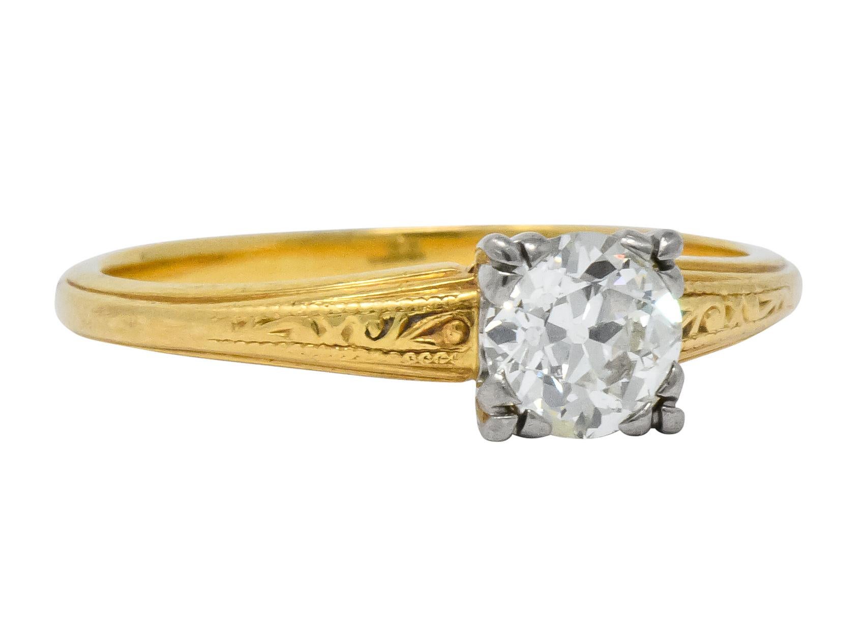 Centering an old European cut diamond weighing approximately 0.90 carat, K color and VVS clarity

Tri-prong white gold decorative head with engraved shoulders mounted on engraved yellow gold shank

Fully signed Jabel

Stamped 18k

Circa 1920's

Ring