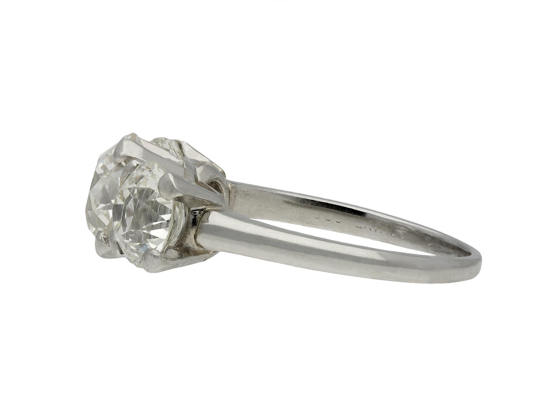 Jabel old cut diamond three stone ring. Set centrally with a round old cut diamond in an open back claw setting with an approximate weight of 1.45 carats, flanked further with two round old cut diamonds in open back claw settings with a combined