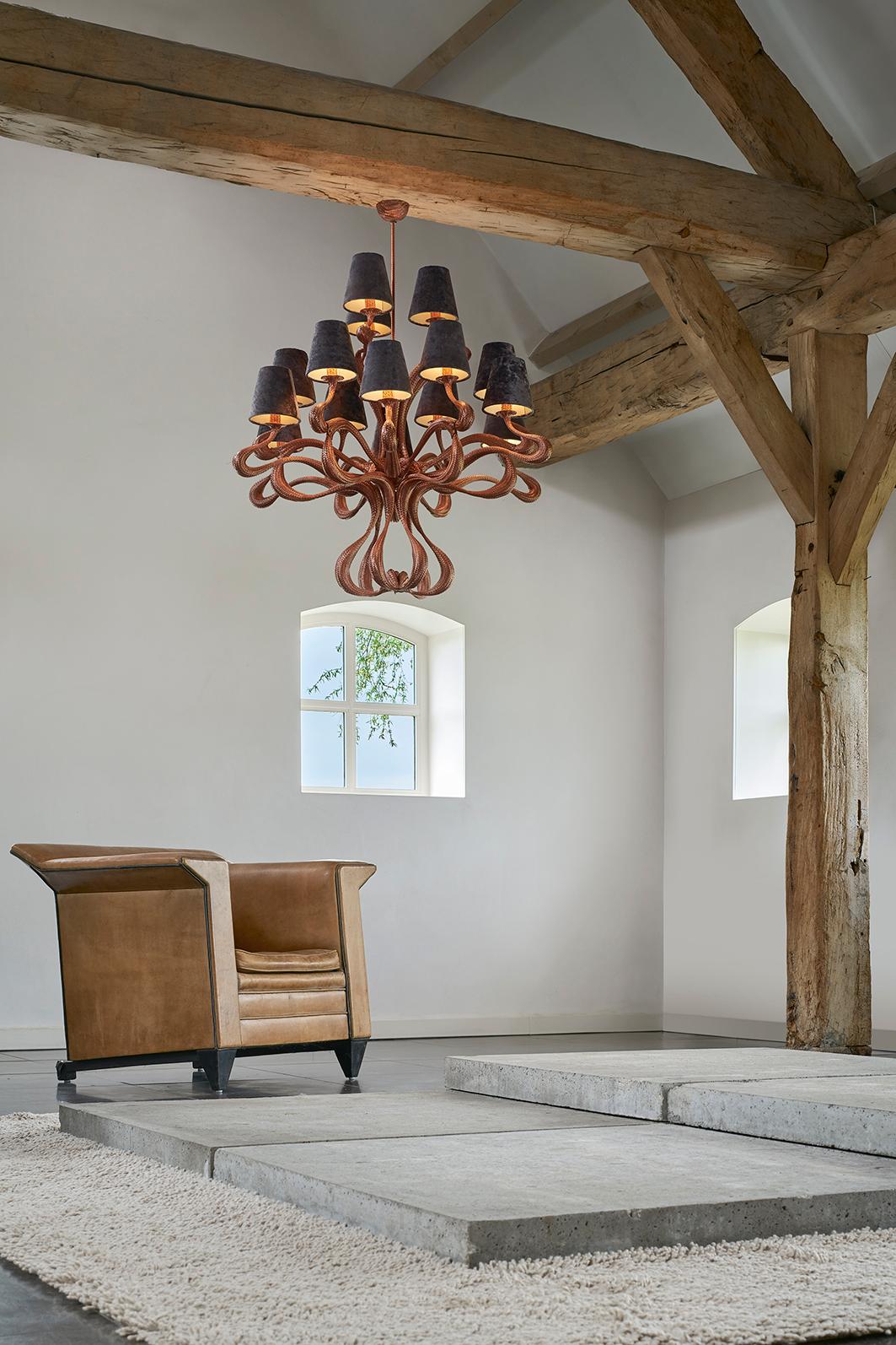 Being an homage to 17th century chandeliers, it serves as a lyrical reference to those graceful forms while placing itself squarely in the 21st century due to the material it’s made of. The high-pressure hose curling into 15-light configuration is