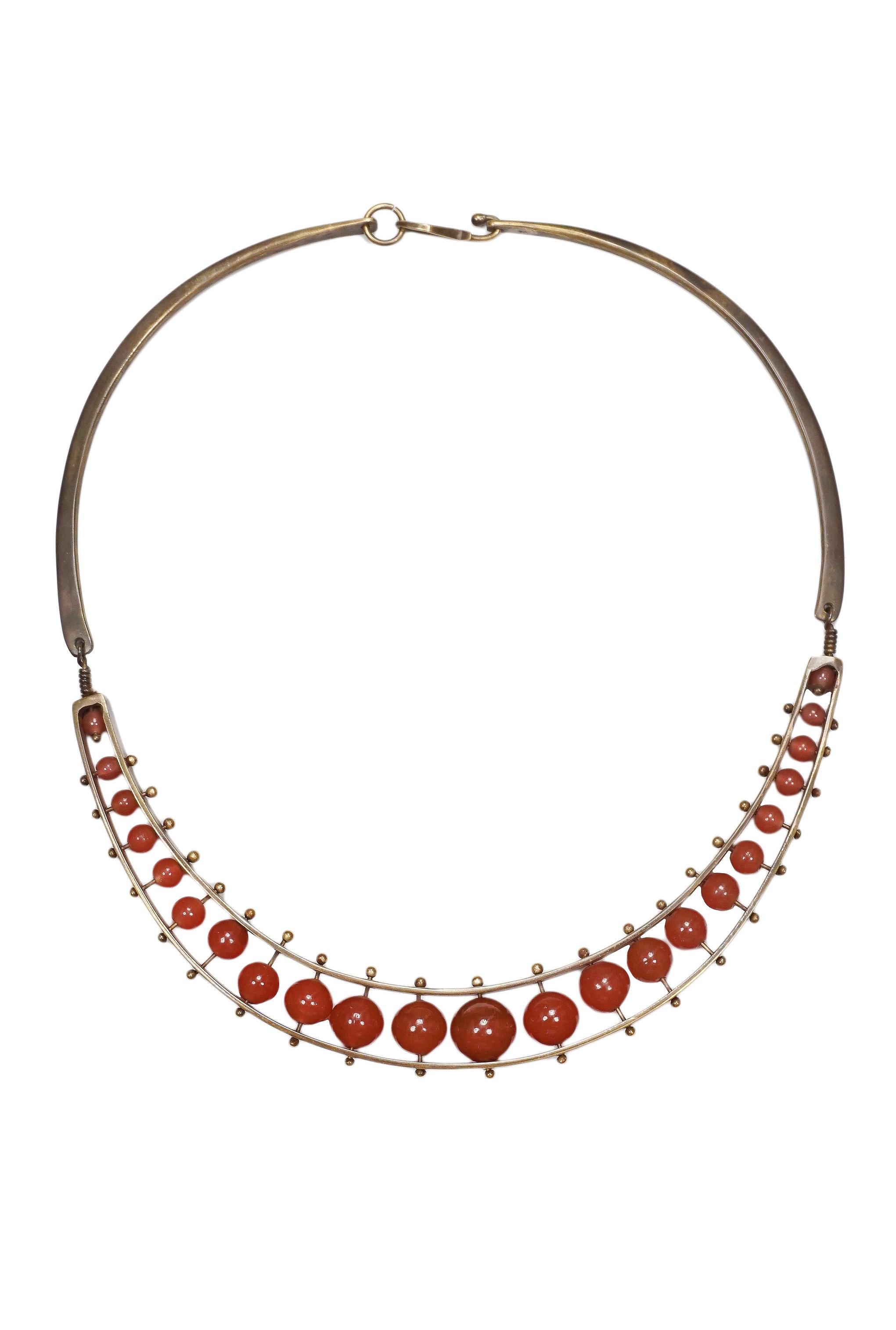 Resurrection Vintage is excited to offer a vintage Jack Boyd bronze necklace with round carnelian gemstones fastened with bronze pins and balls. Circa, 1970's.

Jack Boyd
One Size
Metal and Carnelian 
Excellent Vintage Condition
Authenticity