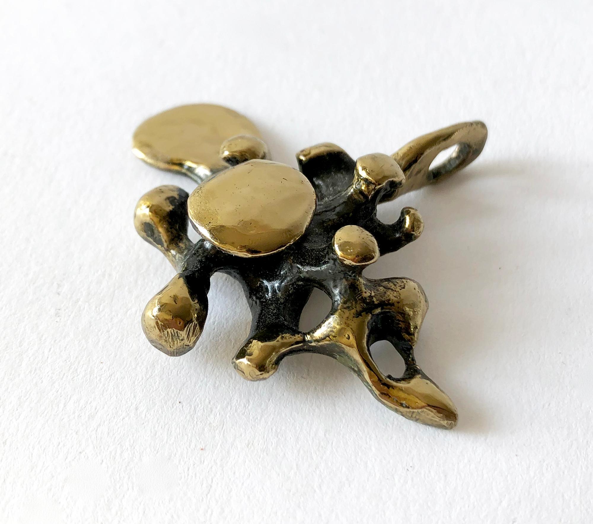 Bronze spore pendant created by sculptor and jeweler Jack Boyd  of San Diego, California. Pendant measures 2 1/8