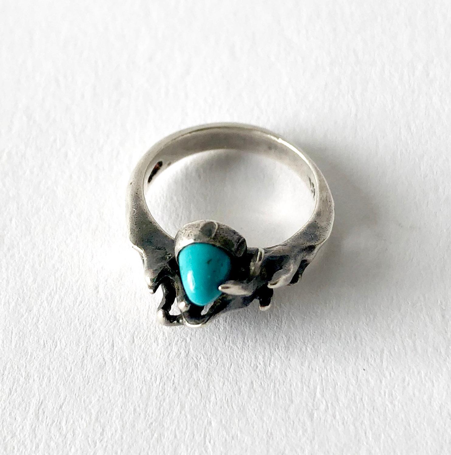 Sterling silver and turquoise organic modernist ring created by sculptor and jeweler Jack Boyd of San Diego, California.  Ring is a finger size 6 and is signed with the artists hallmark of JB.  A modern alternative to an engagement or wedding ring. 