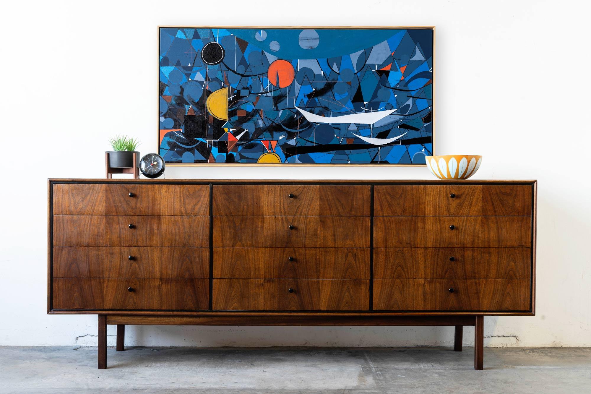 Walnut dresser designed by Jack Cartwright for Founders. A beautiful and substantial 12 drawer dresser featuring lovely grain patterns. Thin edge style reminiscent of Herman Miller designs of the time. Minor marks to body of dresser (see pictures