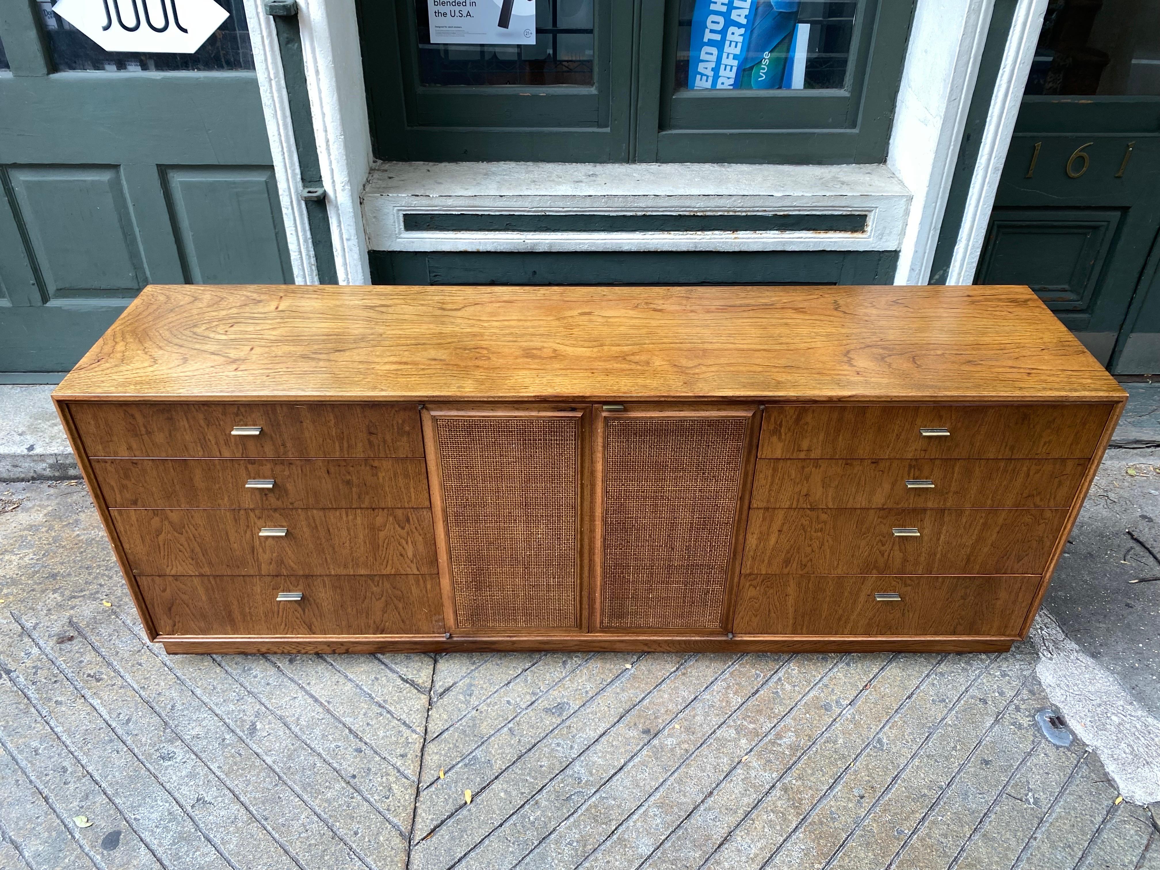 Jack Cartwright for Founders Furniture Company Credenza or Buffet.   But also can be a Dresser!  Original owners were using this multi-functional piece in a bedroom!  Burled Walnut with 2 Cane Covered doors in the middle.  Ample storage and multiple