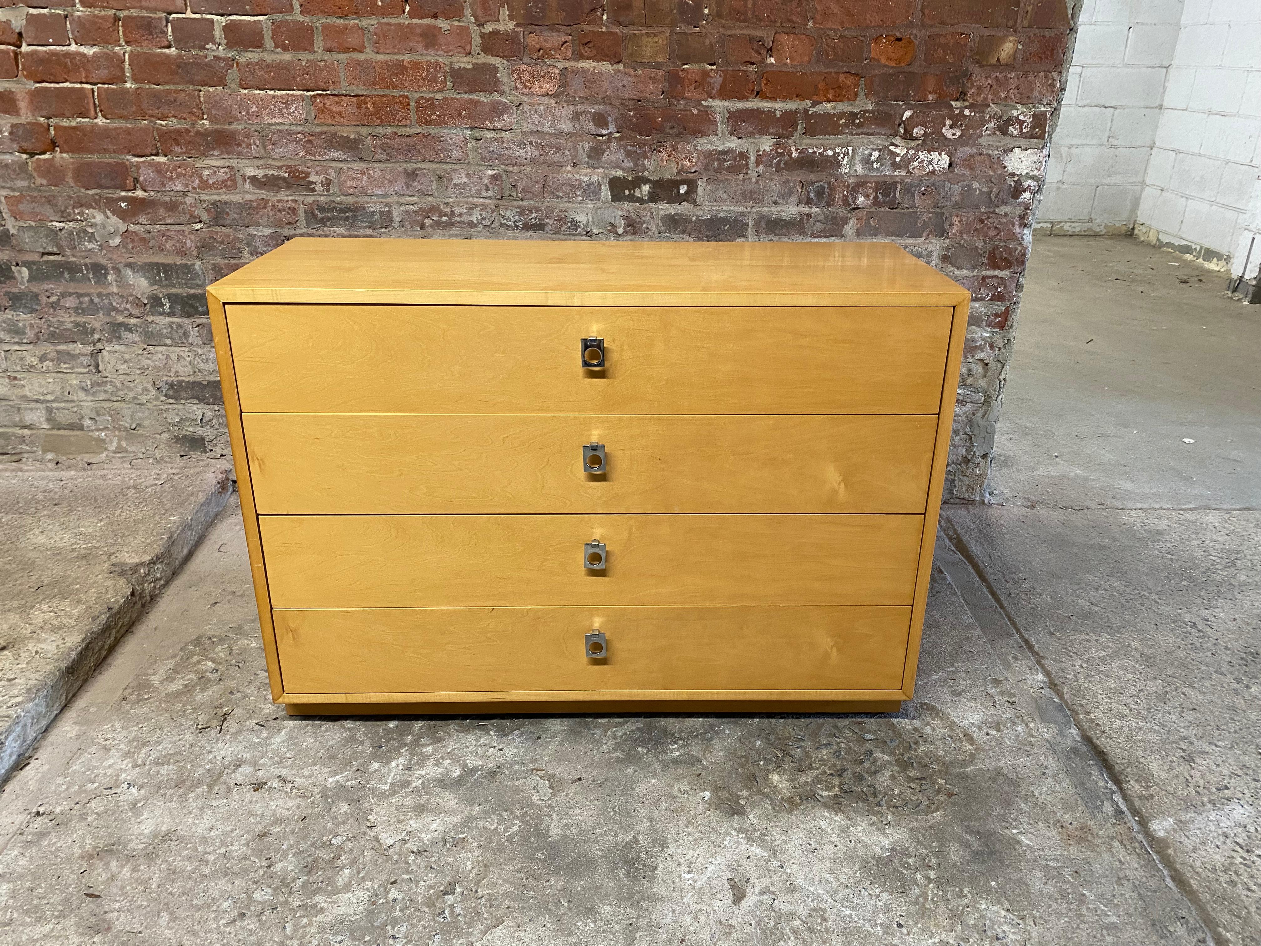 Founders four drawer maple dresser on a plinth base. Chrome drop pulls. Very clean interiors. Circa 1970-80. Signed in top drawer.

Very good condition with some minor scratches and surface abrasions. Original finish.

Approximately 15.5