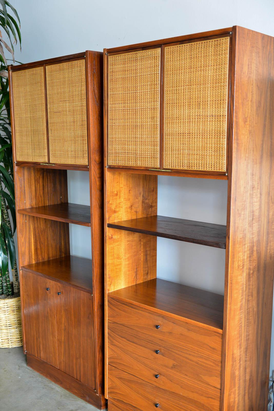 Jack Cartwright for Founders Furniture walnut and cane cabinets, circa 1960. Can be paired together or separately, beautiful grained walnut with perfectly patinated cane doors in excellent condition with no breaks. Original brass door hardware and