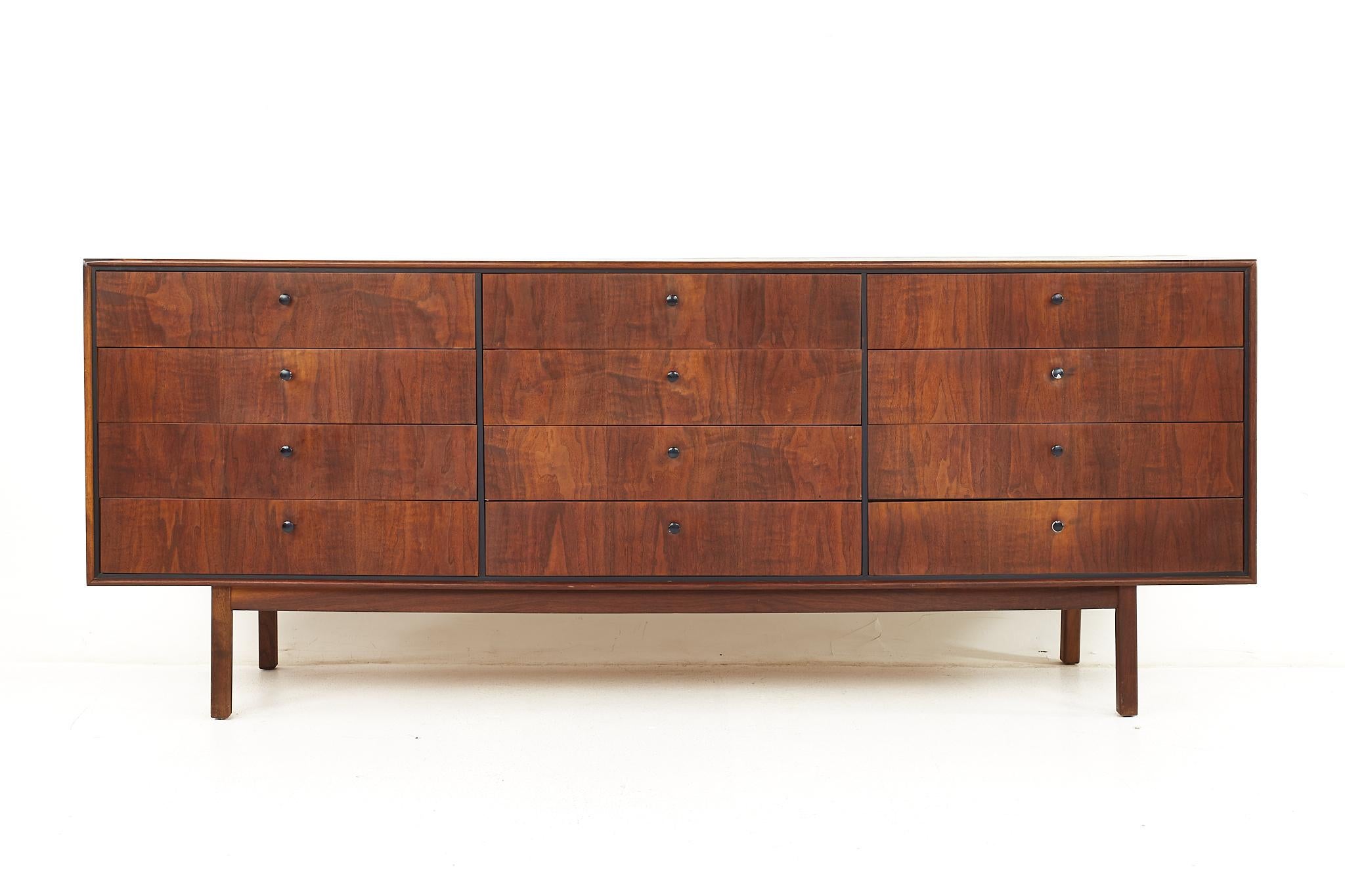 Jack Cartwright for founders mid century 12 drawer lowboy dresser

The dresser measures: 77.5 wide x 18 deep x 31 inches high

All pieces of furniture can be had in what we call restored vintage condition. That means the piece is restored upon