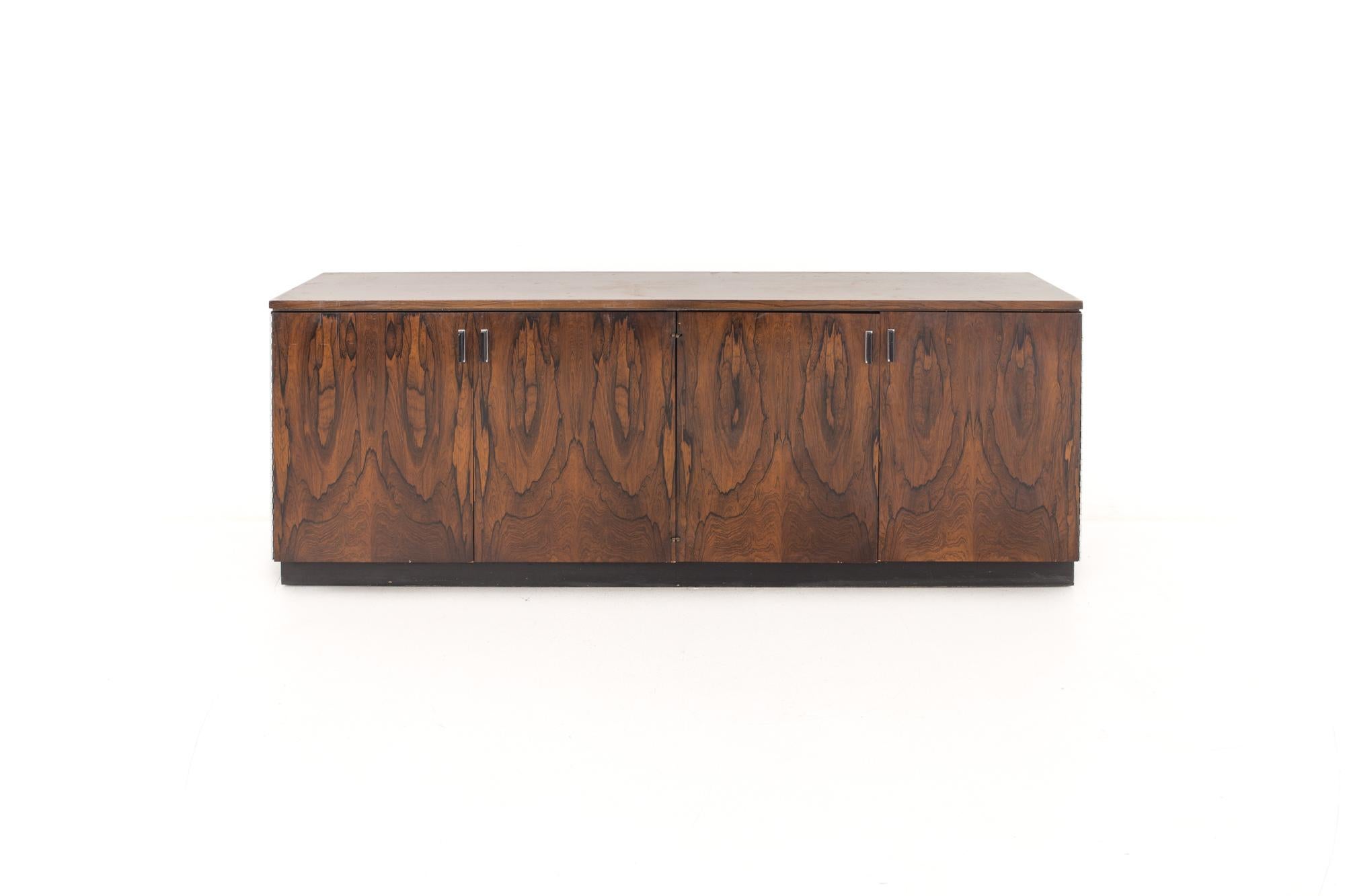 Jack Cartwright for Founders mid century rosewood credenza

This piece measures: 71 wide x 18 deep x 27 inches high

All pieces of furniture can be had in what we call restored vintage condition. That means the piece is restored upon purchase so