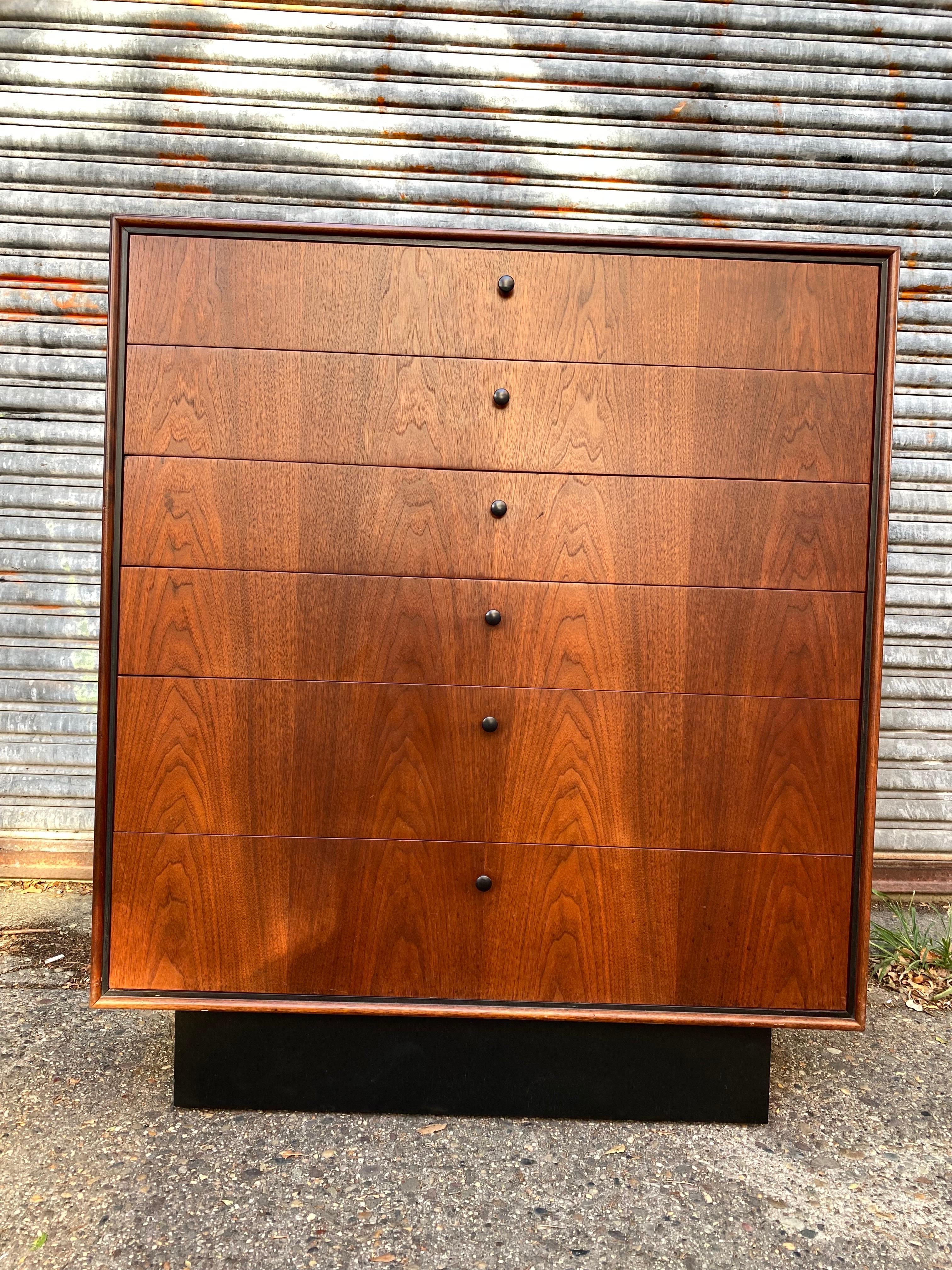 Beautiful Jack Cartwright walnut tall boy, six-drawer, dresser with black base and black wood inset detail. Dove-tale construction of drawers. Newly Refinished and ready to go! 2 Matching Dressers available! Priced individually!