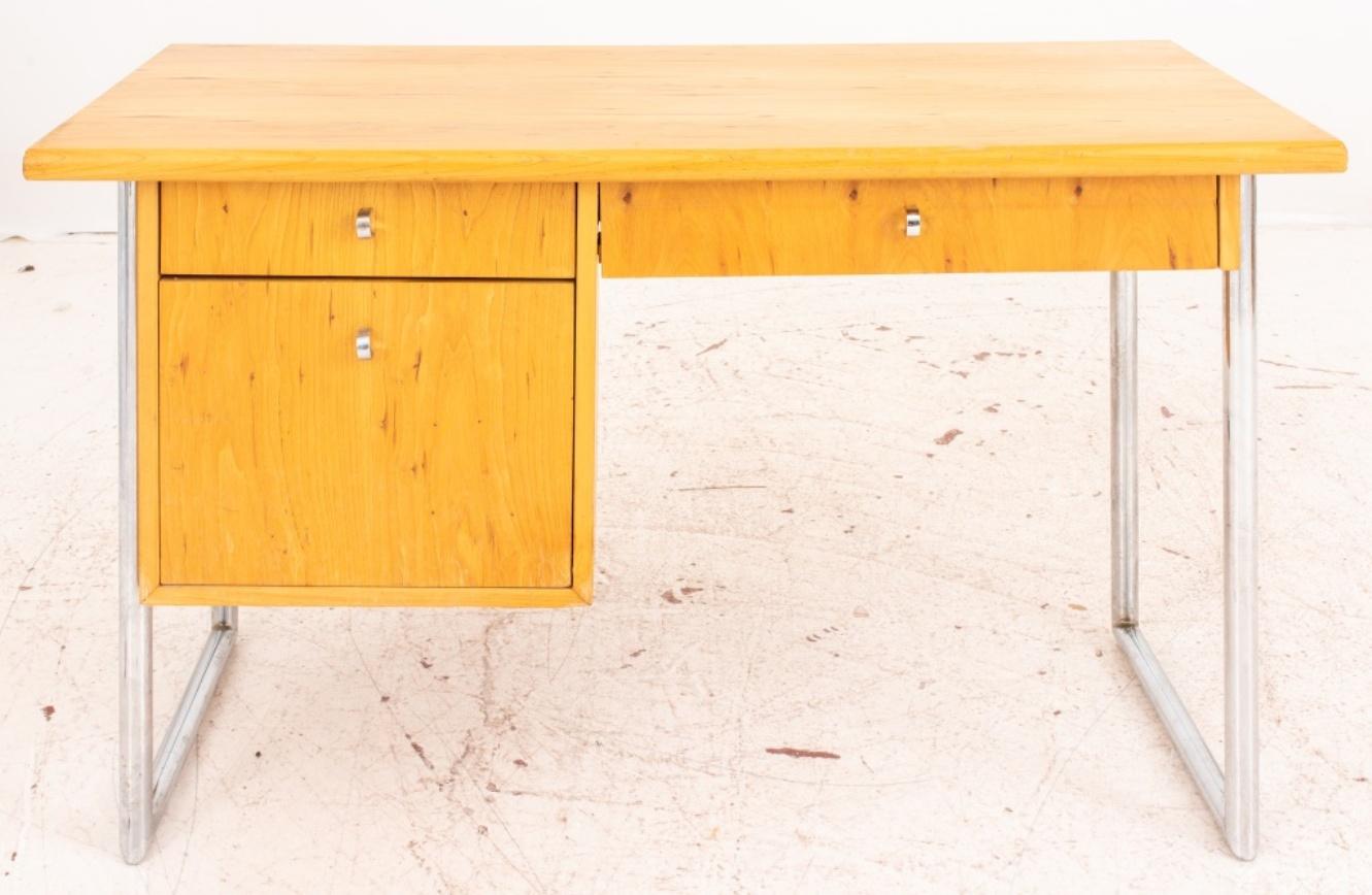 Jack Cartwright (American, 1929-1921) for Founders, Mid-Century Modern elm and chrome desk (designed 1956-1963), with blonde elm top and drawer facings held by a chromed frame, with short drawers to right and left, and a file drawer to left.