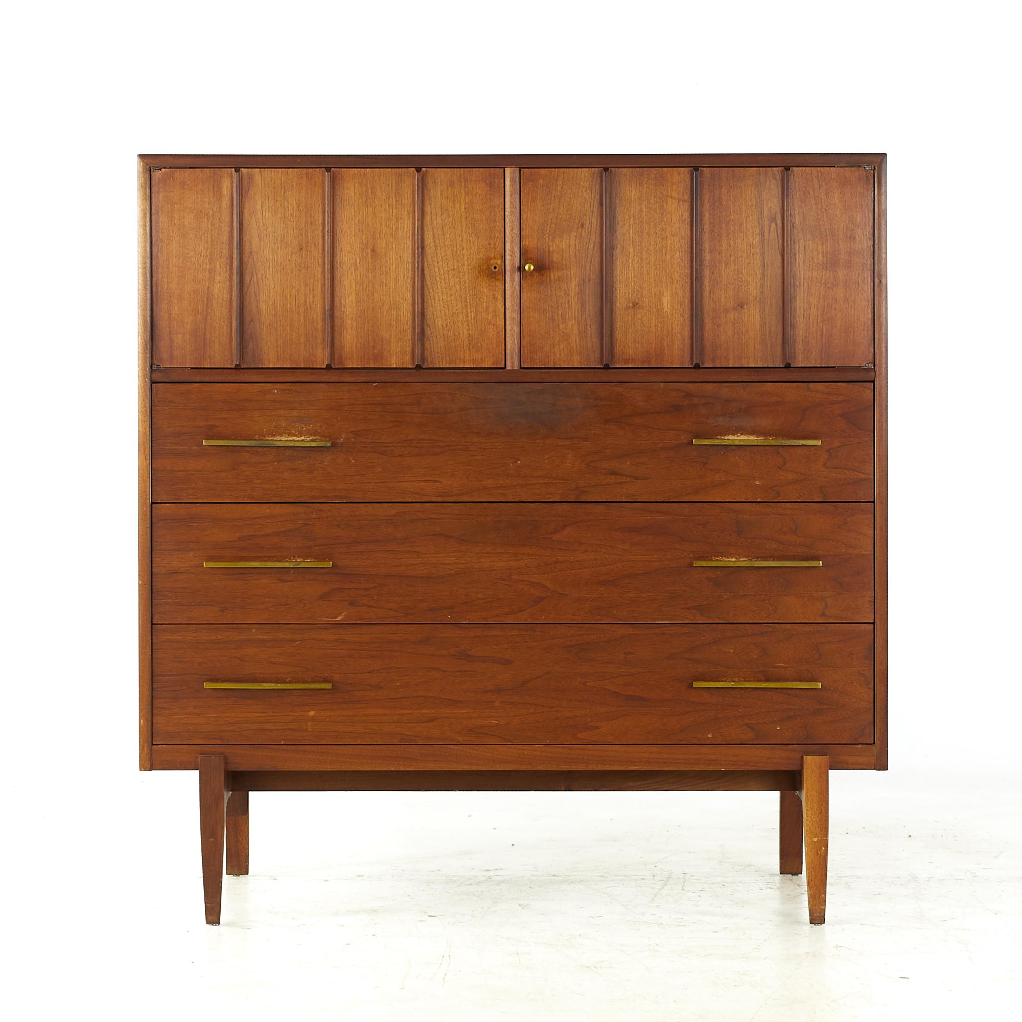 Jack Cartwright Style Ramseur midcentury walnut and brass highboy dresser

This highboy measures: 44 wide x 18 deep x 45.5 inches high

All pieces of furniture can be had in what we call restored vintage condition. That means the piece is