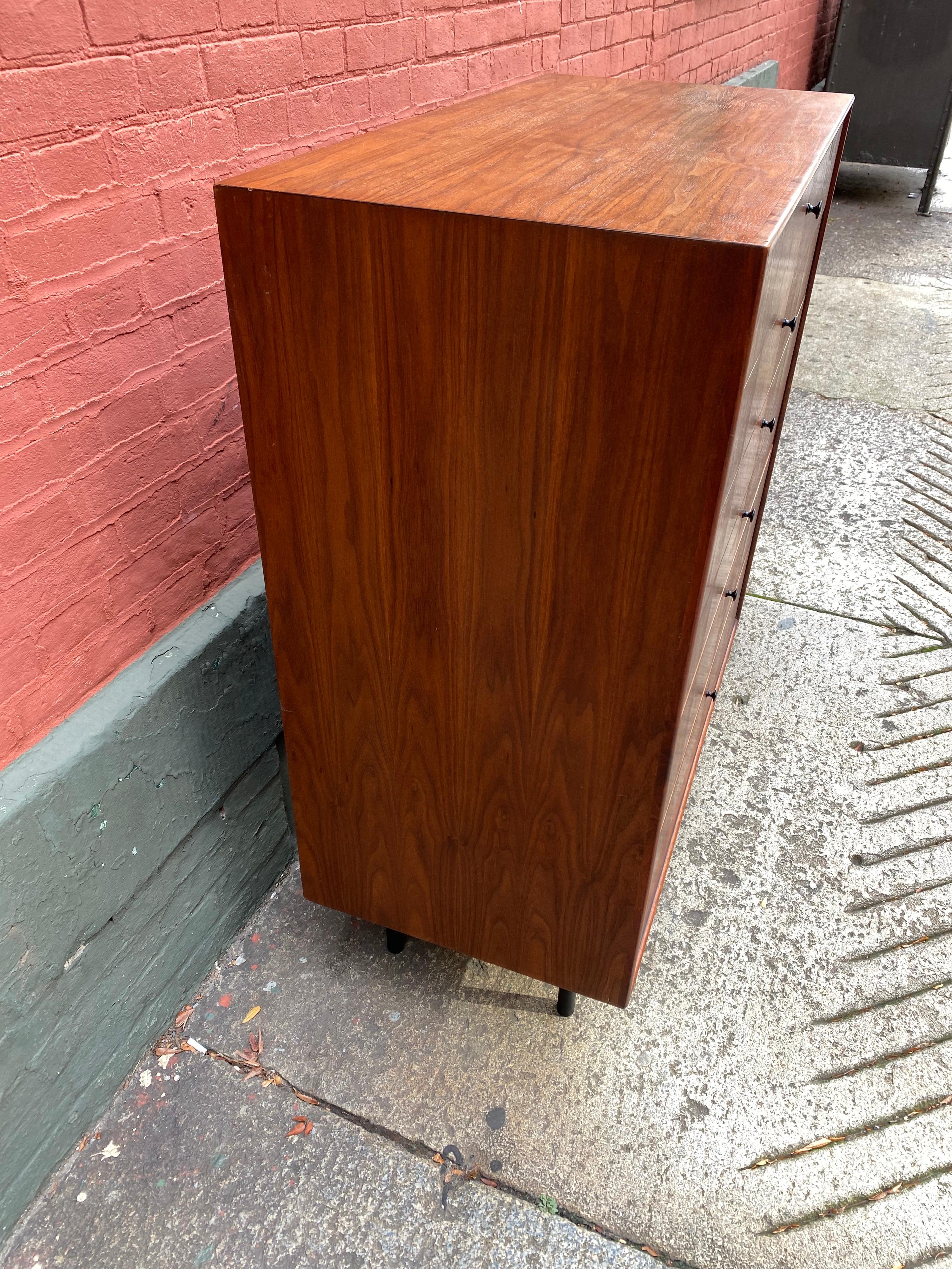 Beautiful Jack Cartwright walnut tall boy dresser with black wood inset detail and six drawers. Dovetail construction of drawers. Two available for sale.
size: 18