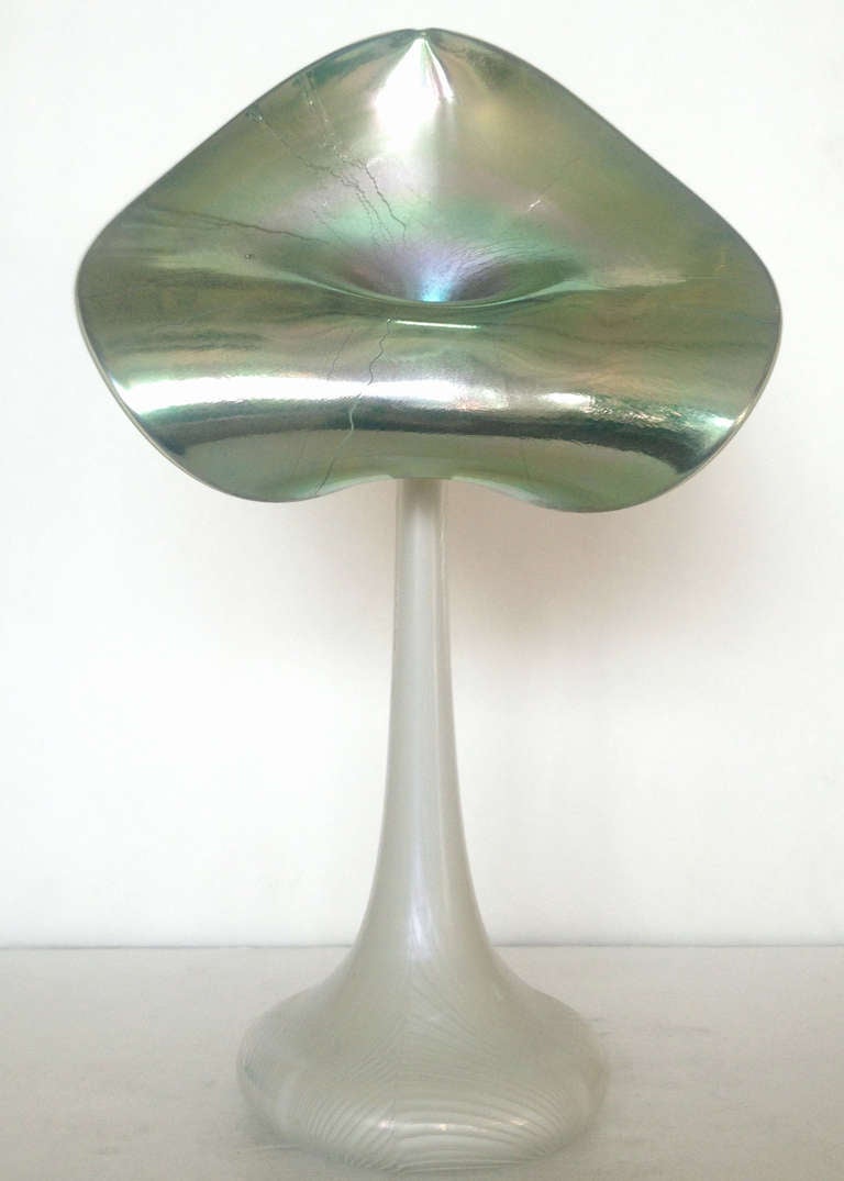 Jack-in-the-pulpit art glass vase with iridescent glass pedals and rib pattern back. Signed by Stuart Abelman, dated 1988.