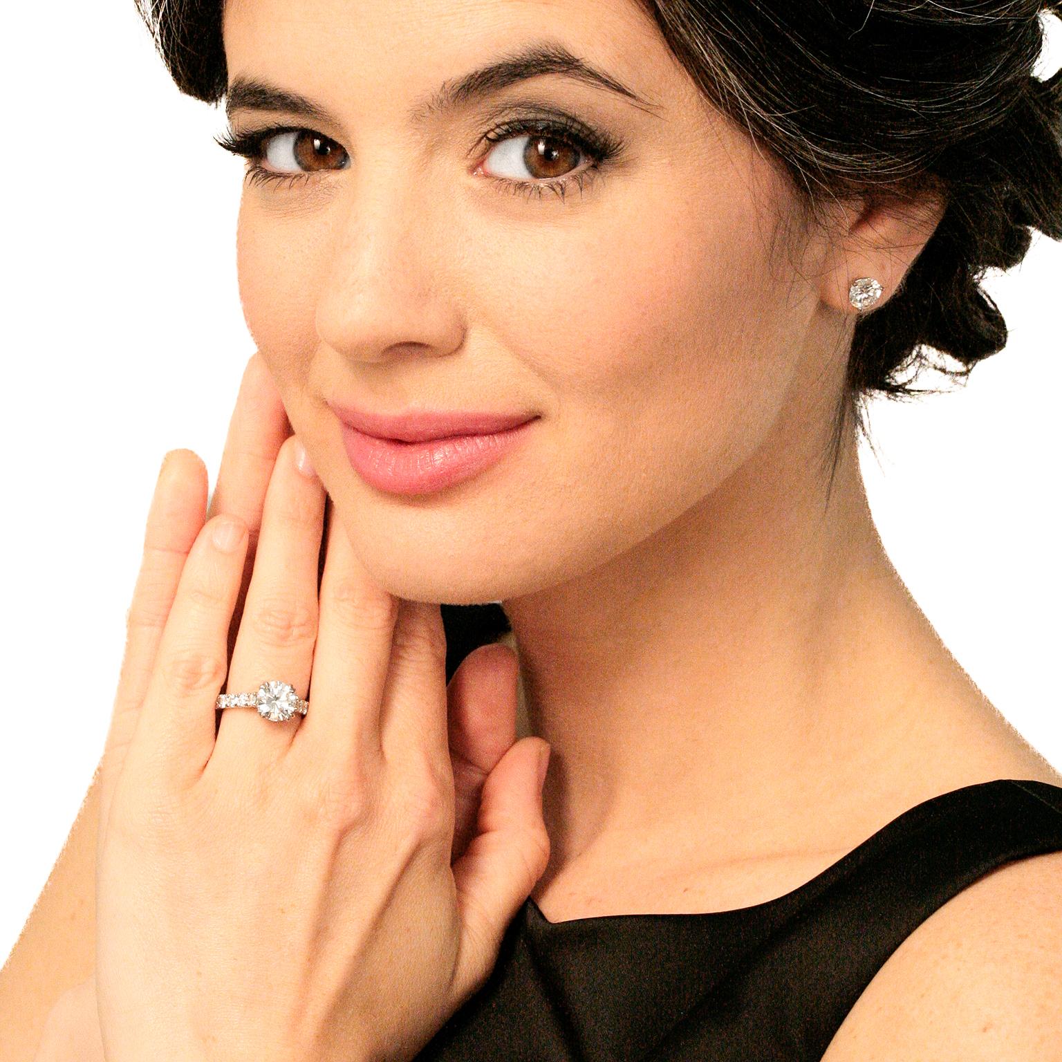 Circa 1990s-2000, platinum, by Jack Kelege, America.  This stunning engagement ring by the renowned bridal artist, Jack Kelege, begins with a brilliant white 2.03-carat diamond (E color, SI1 clarity GIA Report), and is completed by 1.50 carats of