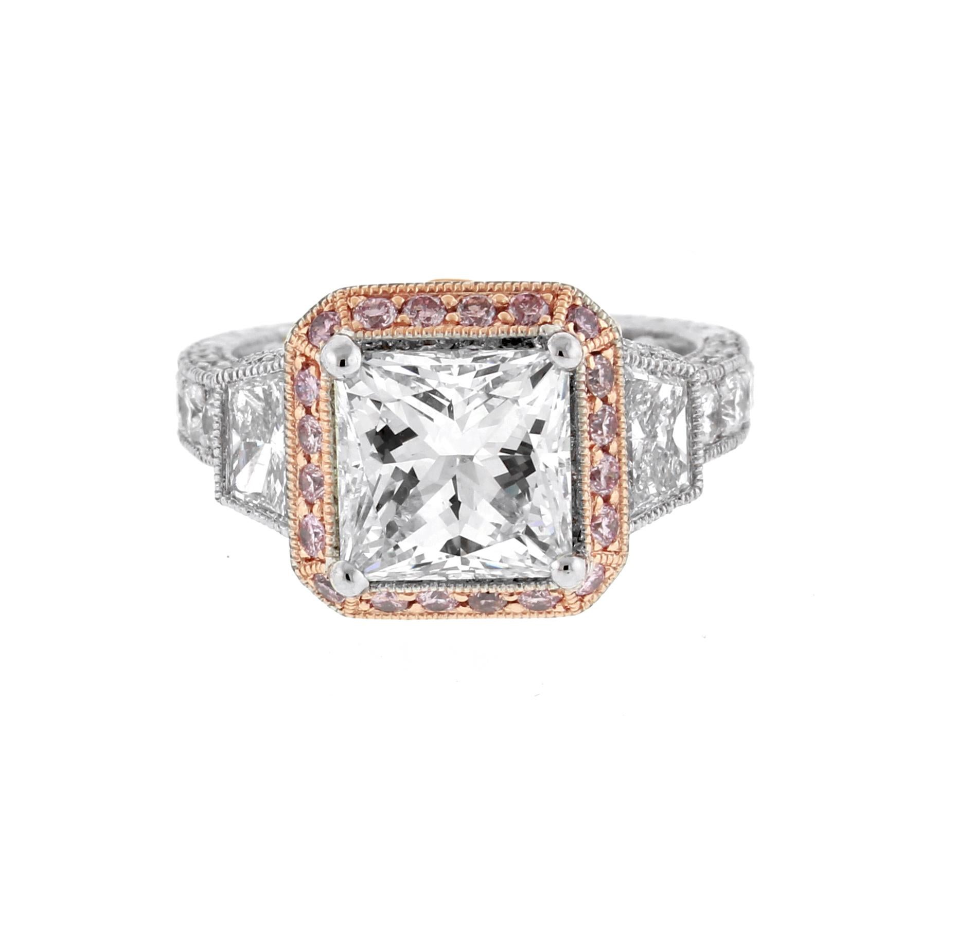 From the  the Jack Kelége Heratage collection,  a 3 carat princess cut diamond surrounded by natural pink diamonds with diamond trapezoids and white diamonds. The Heritage Collection radiates a sense of luxurious creativity that is expertly tailored
