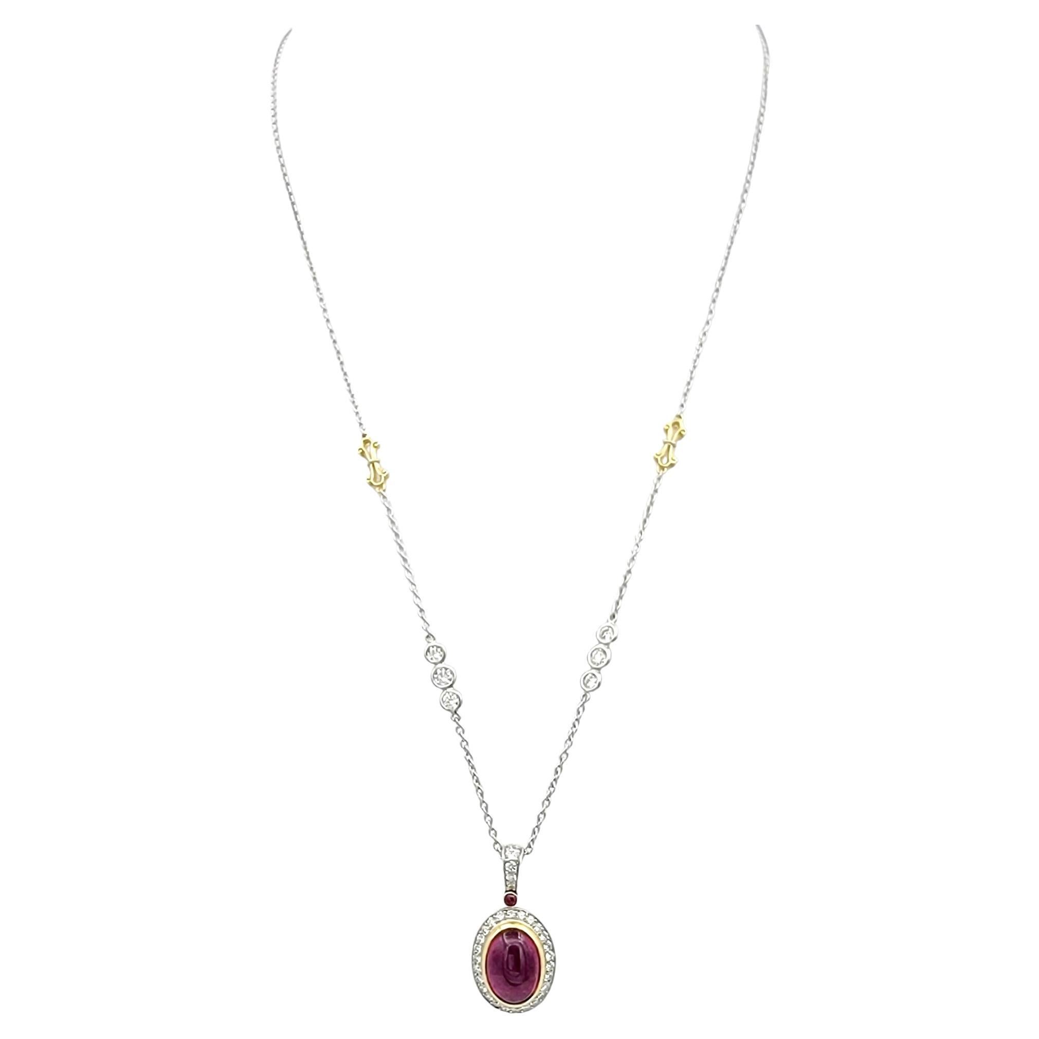 This pendant necklace by esteemed designer, Jack Kelege, is a stunning display of shimmer and exquisite design. The focal point is an oval cabochon pink tourmaline, bezel-set in rich 18-karat yellow gold, creating a warm and captivating centerpiece.