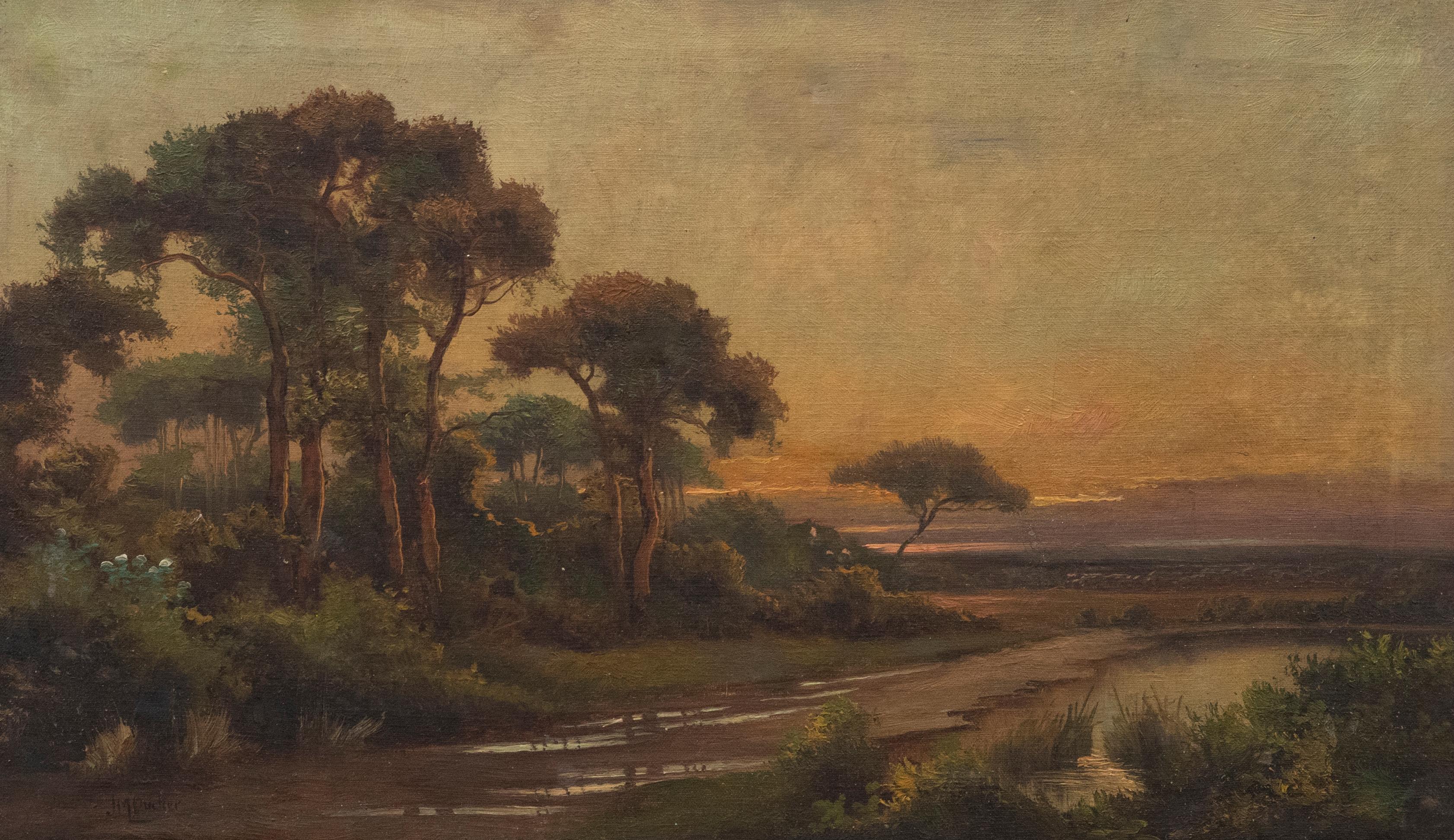 This accomplished landscape depicts a river running through the countryside. On the horizon the sun sets casting a warm have over the scene. Signed to the lower right. On canvas.