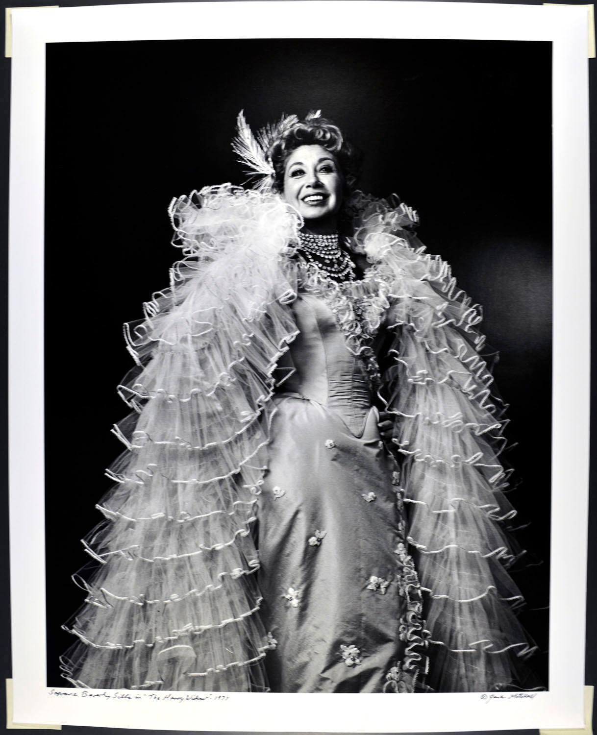 16 x 20" vintage silver gelatin photograph of operatic soprano Beverly Sills in costume for  'The Merry Widow', photographed in 1977. It is signed by Jack Mitchell on the recto and in pencil on the verso. Comes directly from the Jack Mitchell