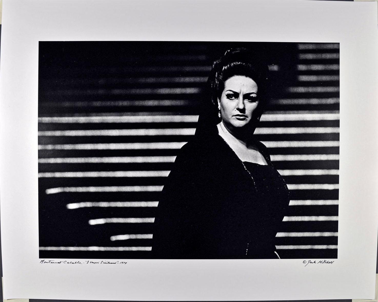 16 x 20" vintage silver gelatin photograph of operatic soprano Monserrat Caballe performing  'I Vespri Siciliani' at the Metropolitan Opera, photographed in 1974. It is signed by Jack Mitchell on the recto and in pencil on the verso. Comes directly