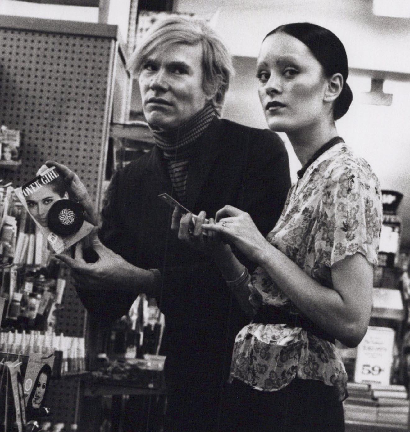 Andy Warhol & Jane Forth Buying Cosmetics in a New York City Drug Store - Photograph by Jack Mitchell