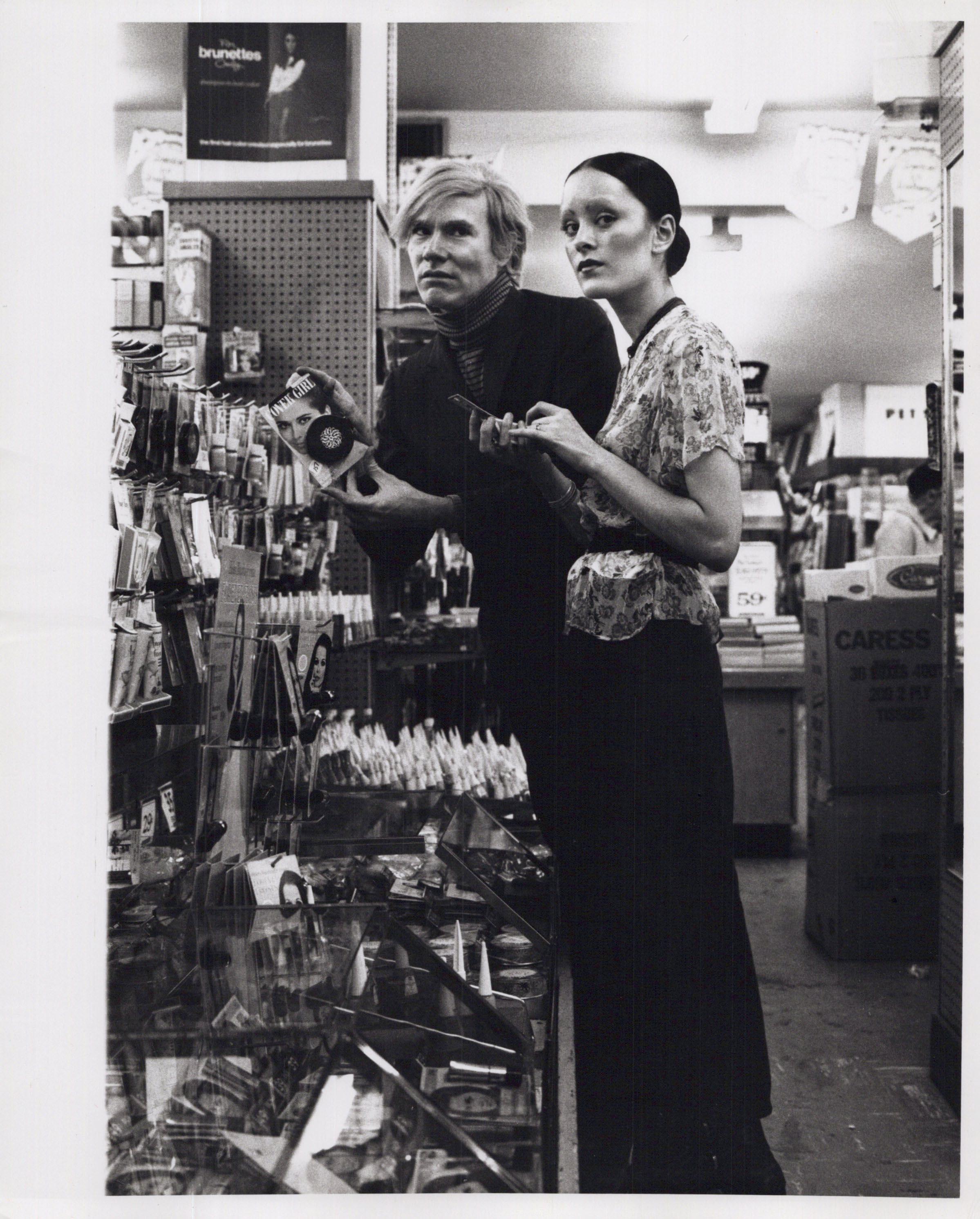 Jack Mitchell Black and White Photograph - Andy Warhol & Jane Forth Buying Cosmetics in a New York City Drug Store