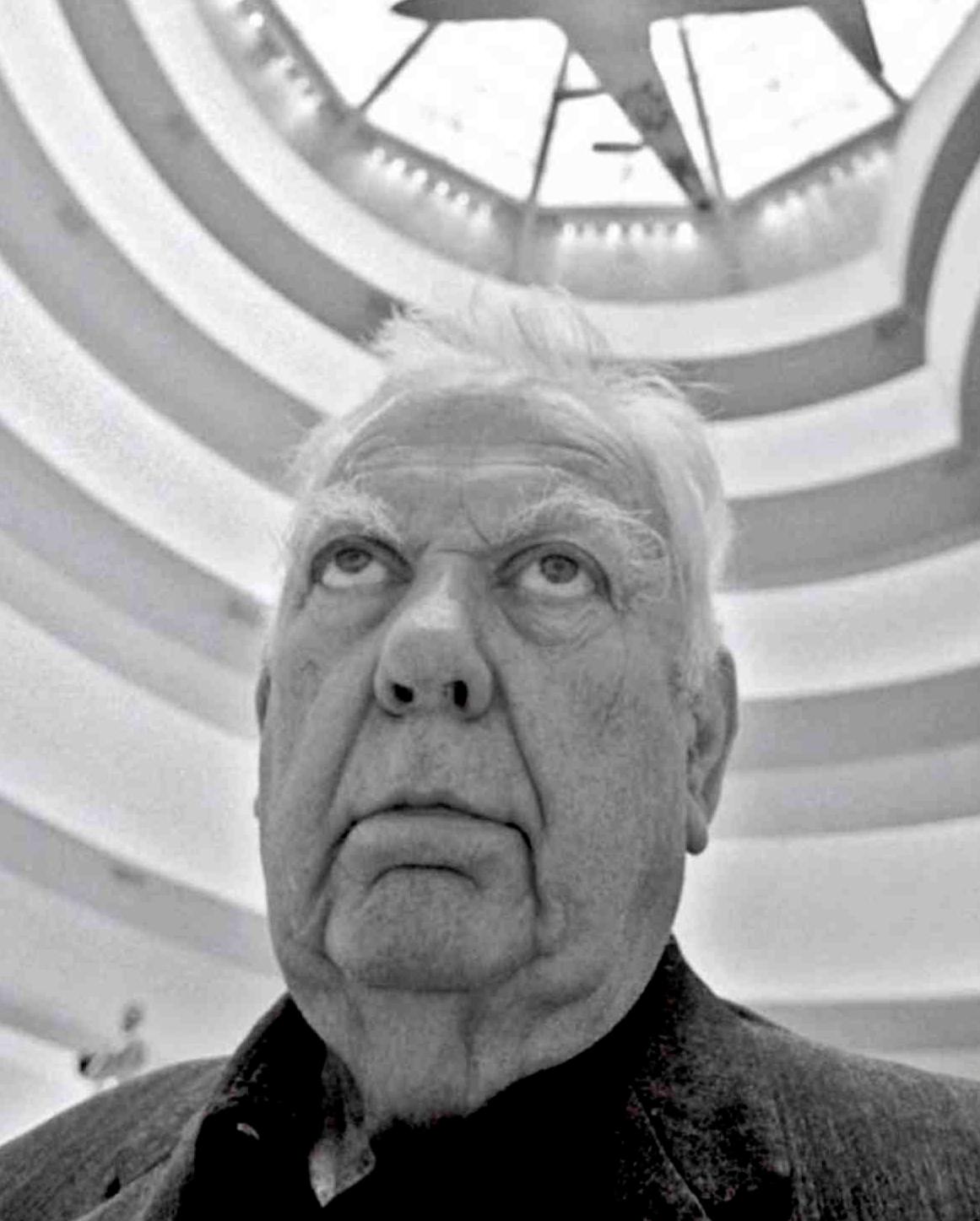 Artist Alexander Calder in the Guggenheim gazing up at his painted jet aircraft  - Photograph by Jack Mitchell