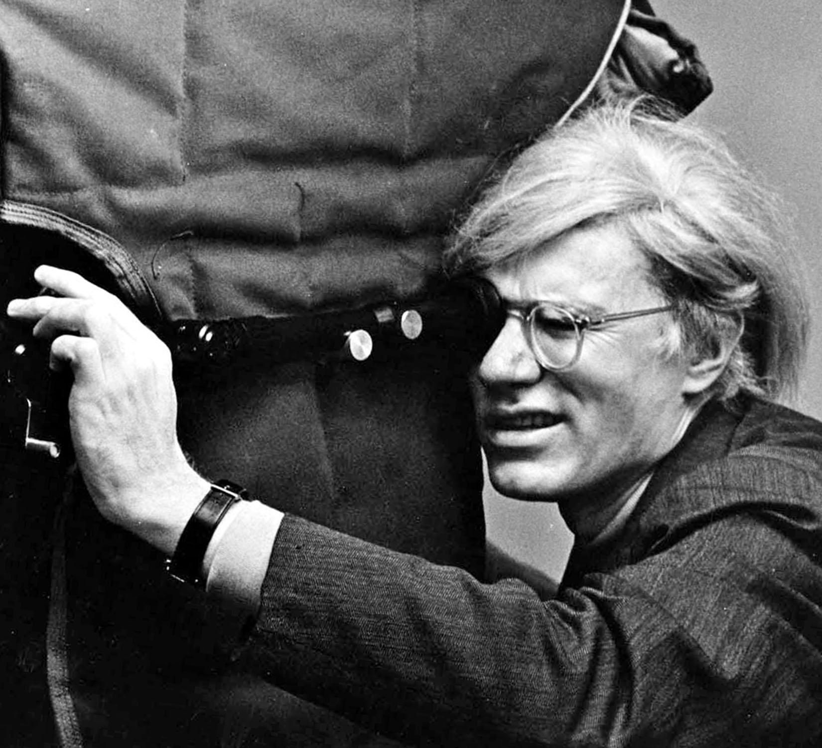  Artist Andy Warhol filming 