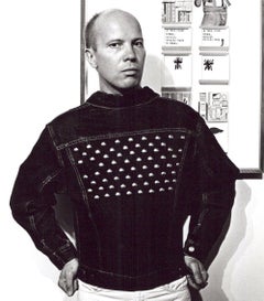 Collagist and correspondence artist Ray Johnson photographed with his work