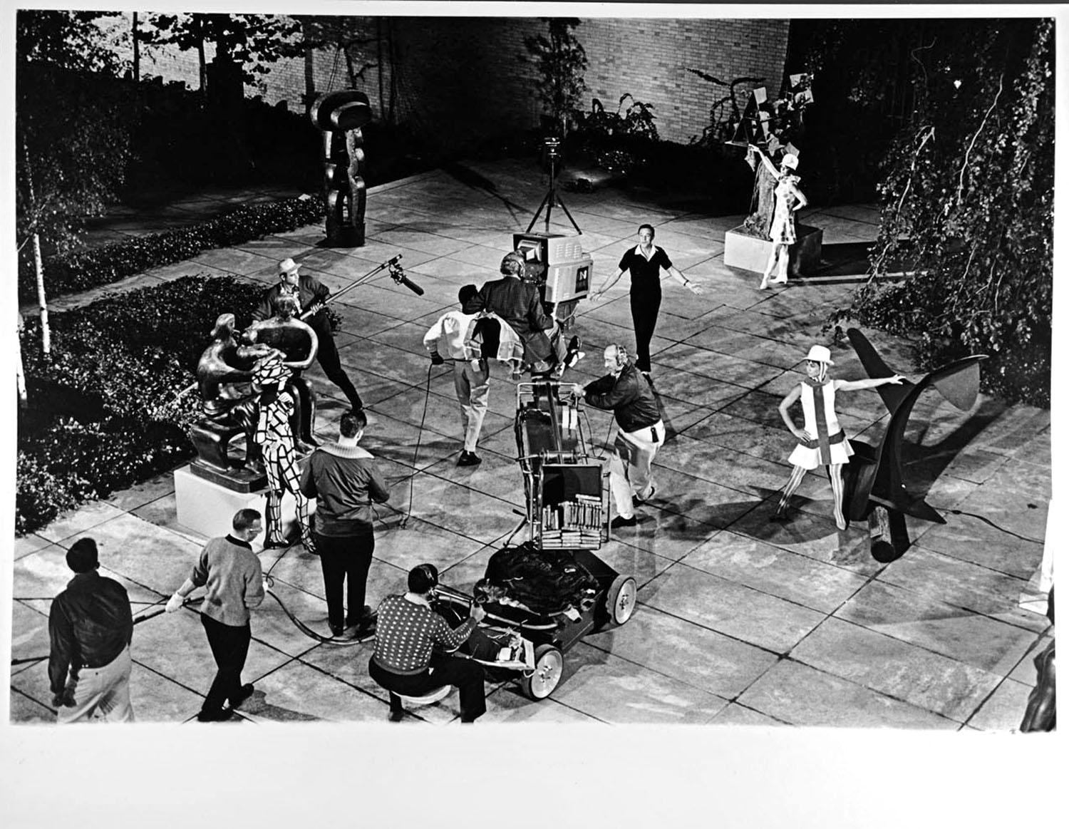 Jack Mitchell Black and White Photograph - Gene Kelly taping CBS Television special 'New York, NY' in MOMA sculpture garden