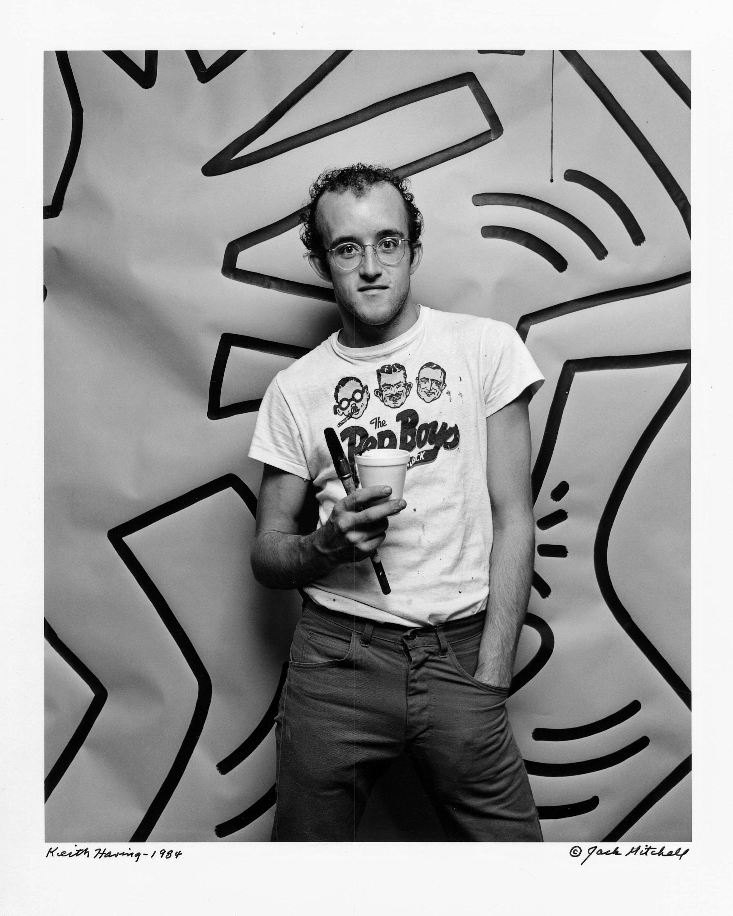 11 x 14" vintage silver gelatin photograph of graffiti artist Keith Haring with a just completed work (on Jack Mitchell
s seamless grey backdrop), 1984. It is signed by Jack Mitchell on the print recto and in pencil on the verso. Comes directly from