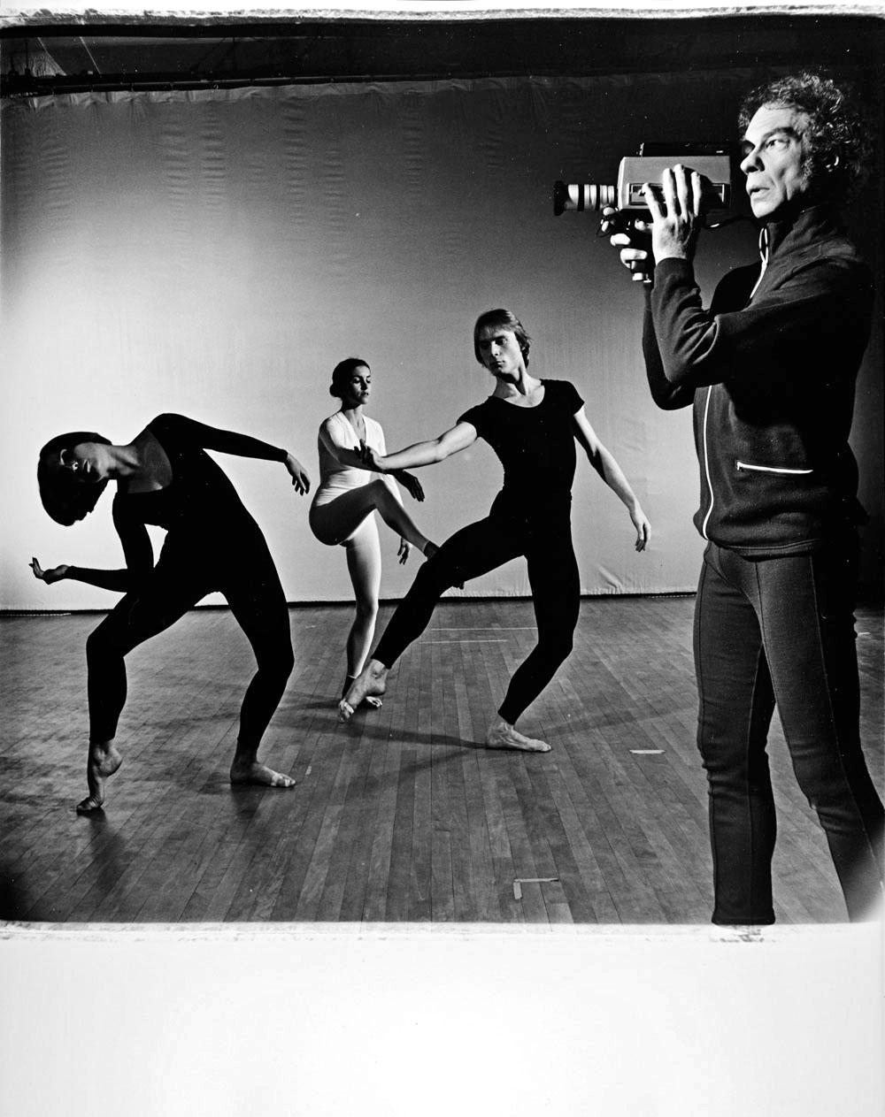Jack Mitchell Black and White Photograph - Merce Cunningham with dancers and video camera performing 'TV Rerun'