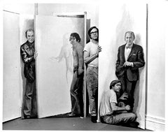 Painter Willard Midgette posing with his paintings