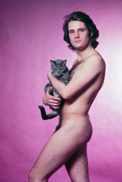 Patrick Ameche holding Nik the studio cat, nude, signed by Jack Mitchell