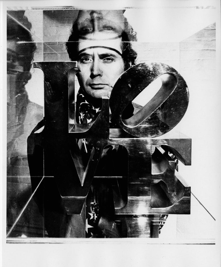 Jack Mitchell Portrait Photograph - Pop Artist Robert Indiana posing in his studio with his famous LOVE sculpture
