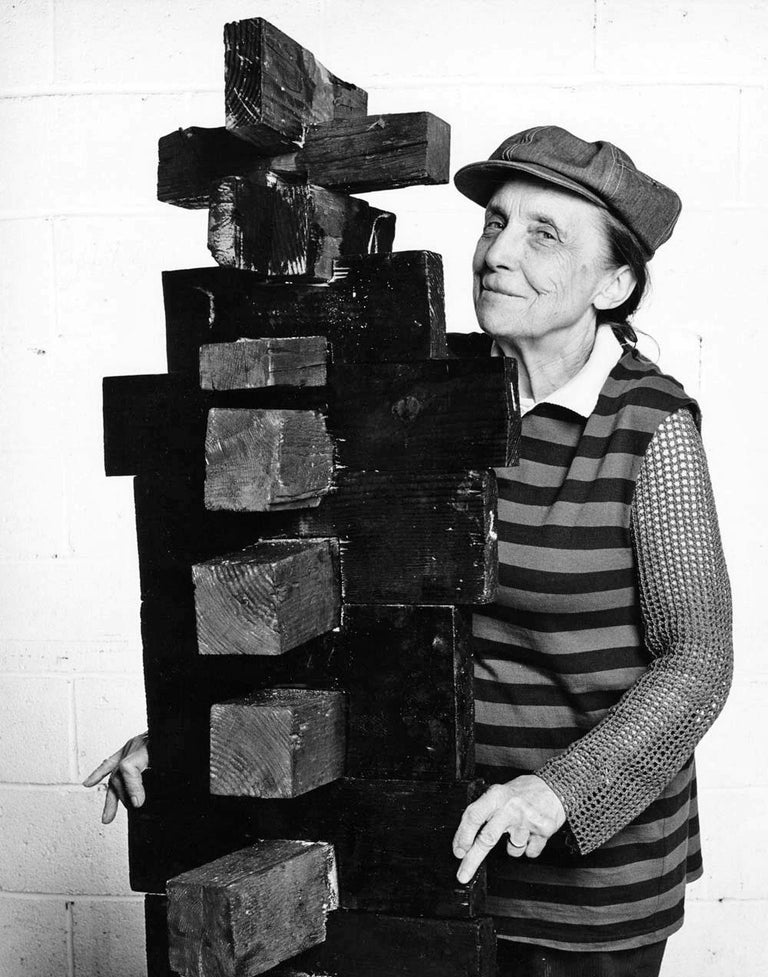 11 x 14" vintage silver gelatin photograph of famed sculptor Louise Bourgeois in her Manhattan studio with recent work in 1982, signed by Jack Mitchell on the verso. Comes directly from the Jack Mitchell Archives with a certificate of authenticity.