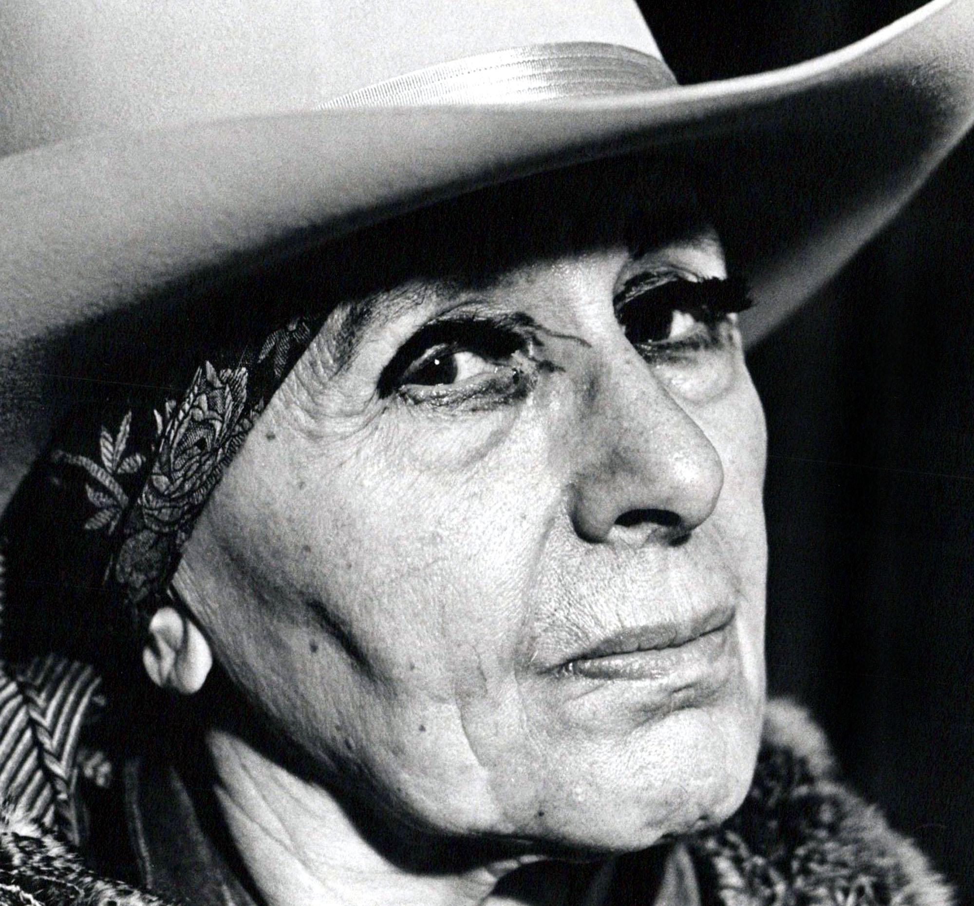 Sculptor Louise Nevelson photographed in her New York City studio - Photograph by Jack Mitchell