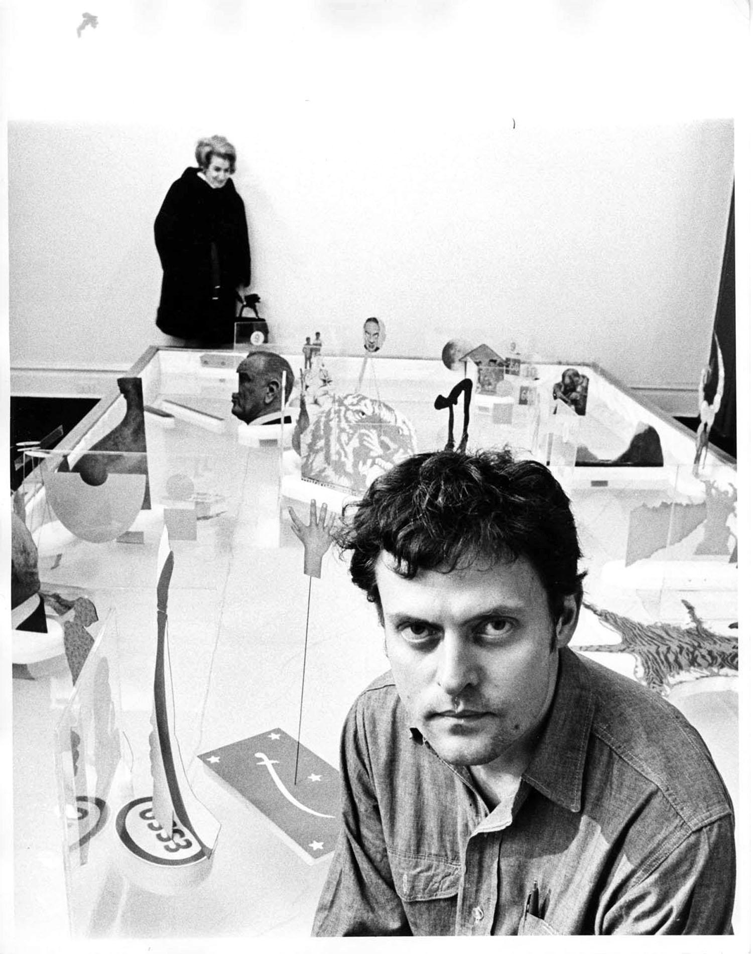 11 x 14" vintage silver gelatin photograph of Swedish Multimedia artist Oyvind Fahlstrom at an exhibition of his work in Manhattan, 1969. Signed on the verso by Jack Mitchell. Comes directly from the Jack Mitchell Archives with a certificate of