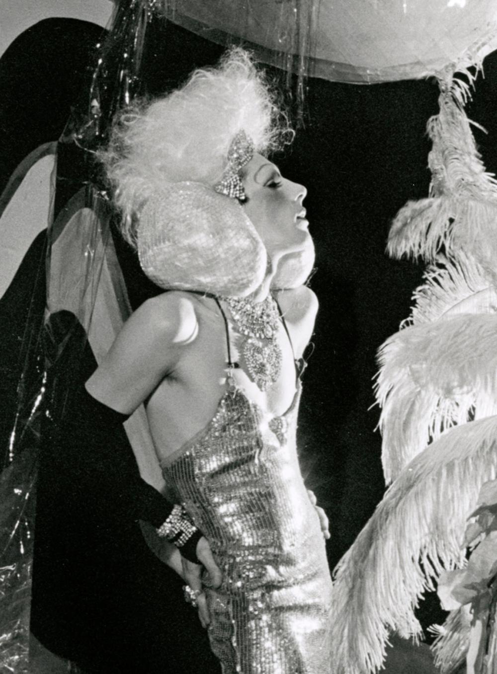 This is a black and white print made from the original negative of Jack Mitchell’s session photographing Roxy Ritz and Wally of the Cockettes on stage performing “Tinsel Tarts in a Hot Coma” in New York City in 1971. It is individually numbered #/25