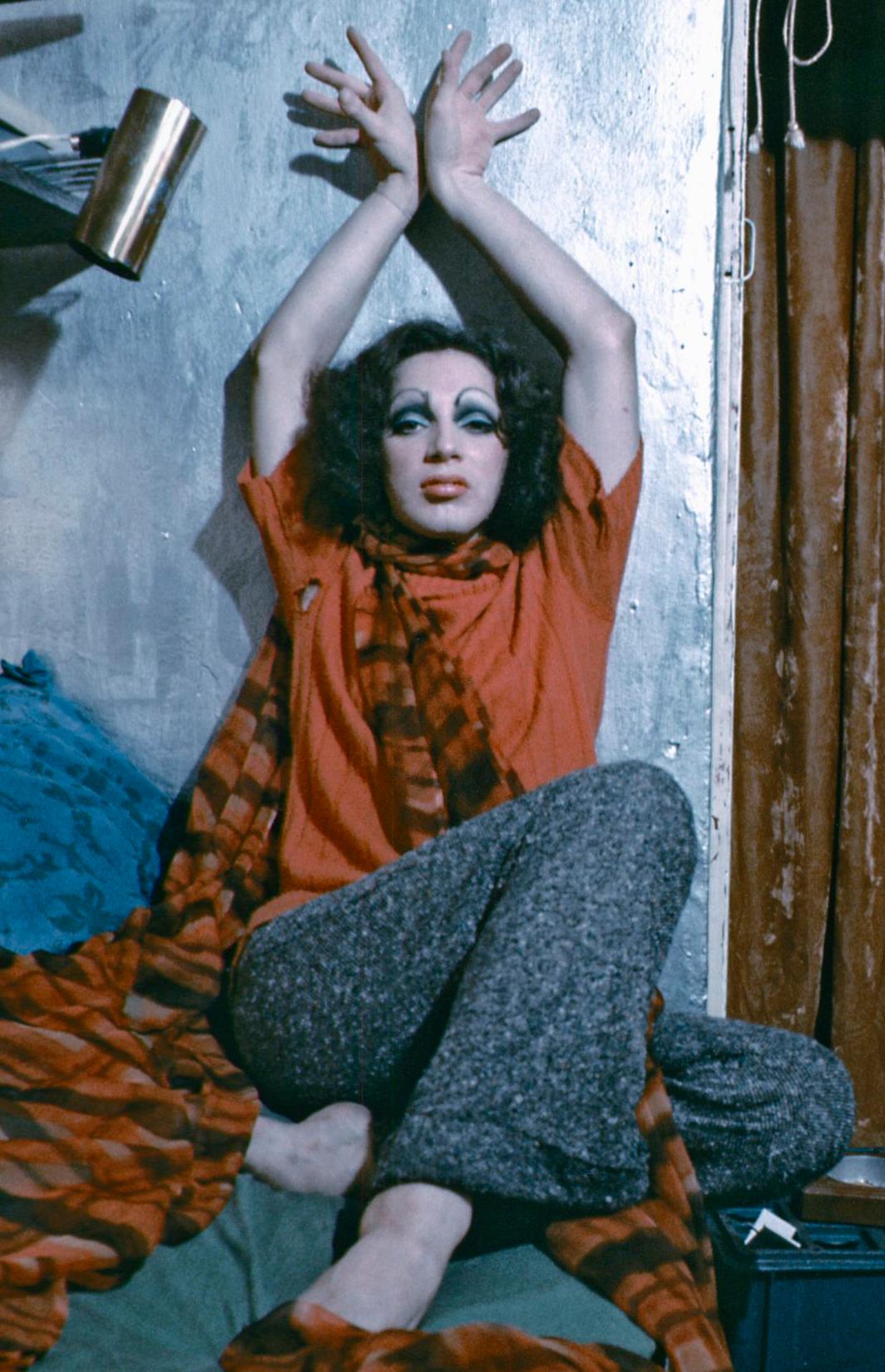 Warhol Superstar Holly Woodlawn in her Greenwich Village apartment - Photograph by Jack Mitchell