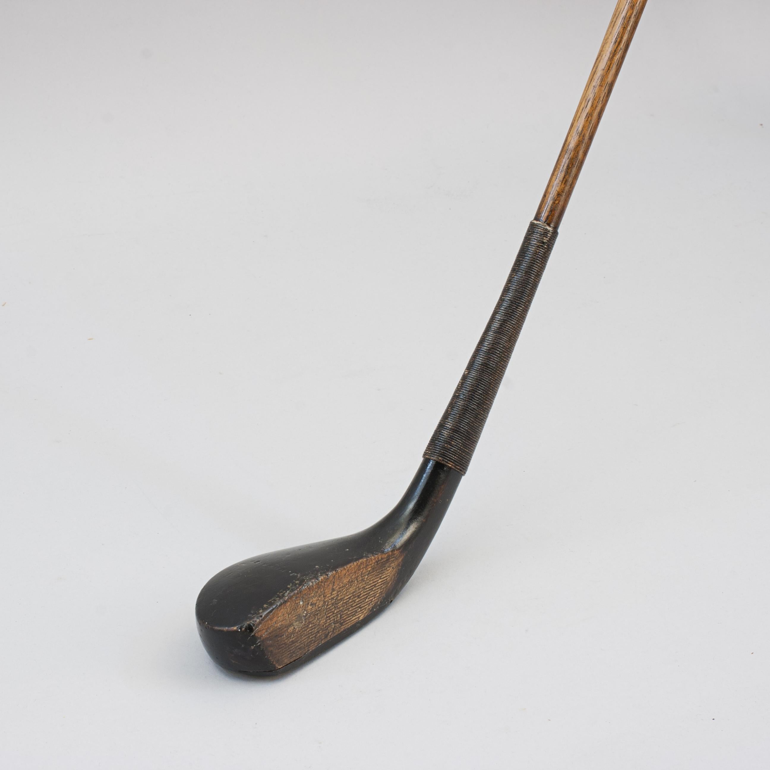 Scared Head Transitional Long Nose Golf Club.
An elegant scared head transitional long nose golf club by Jack Morris of St Andrews. This great looking club is also known as a driver or brassie with a slight loft, it has a black stained club head,