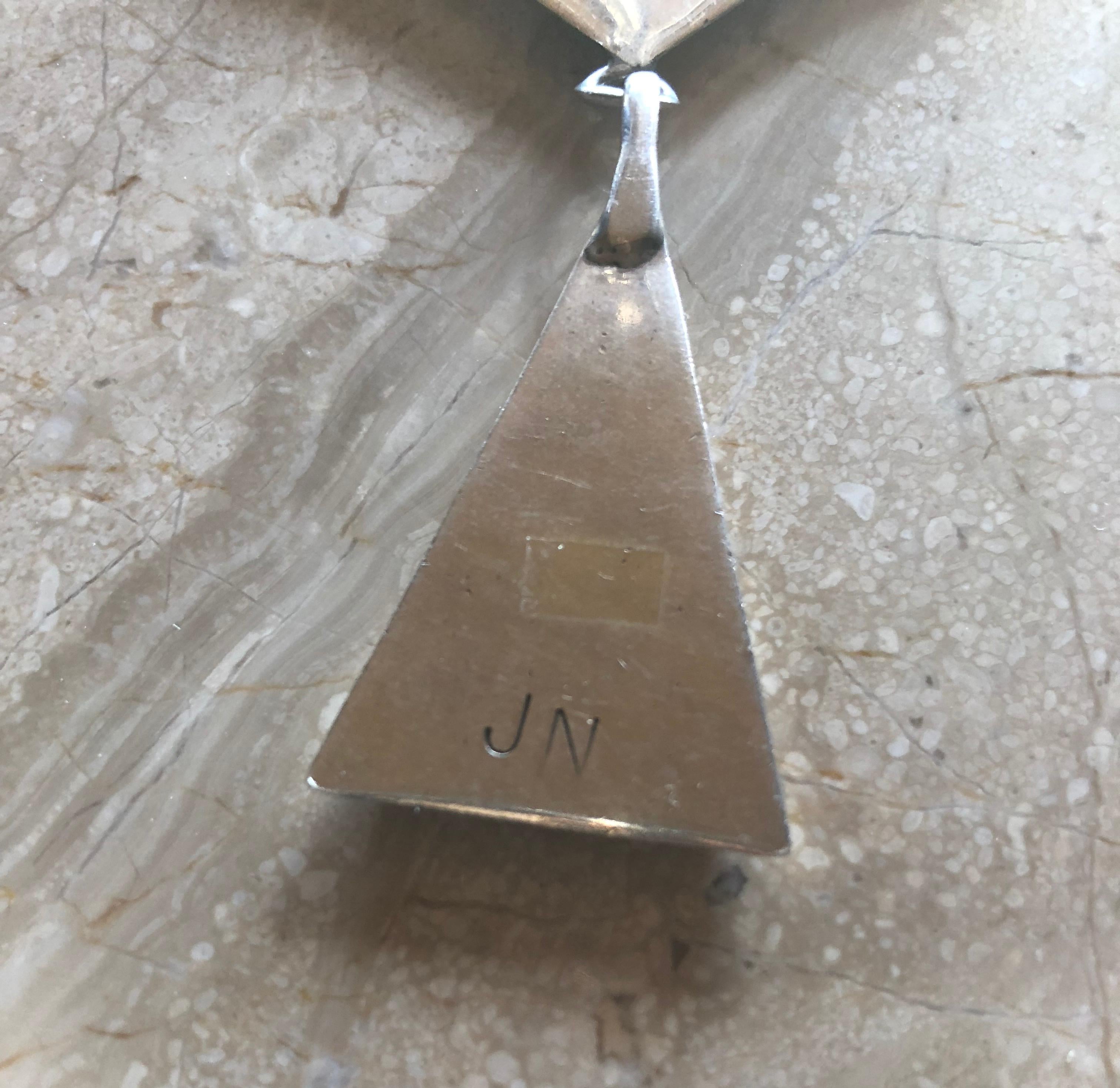 A sterling silver necklace with oxidized recessed design within triangle links by Jack Nutting of San Francisco circa 1960. Necklace has 18