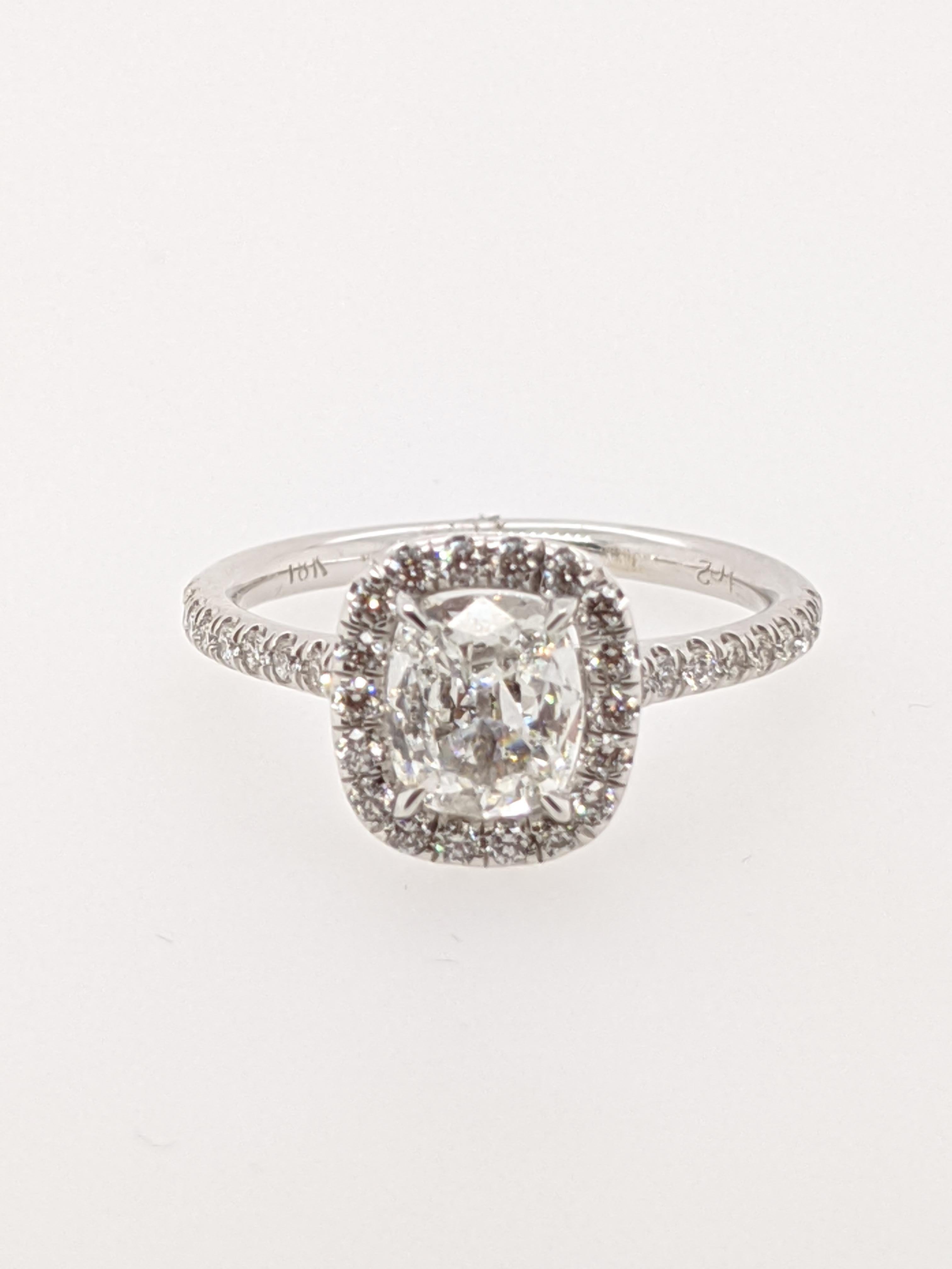 Classic 18 karat white gold  halo ring handmade in the United States.  Featuring a 1.02 carat H color I1 clarity antique style cushion with GIA grading report number 7328624400.

This listing has one of hundreds of cushion cut diamonds in our